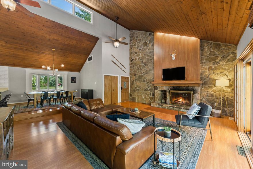 Welcome to The Shenandoah Mountain Retreat, a beautifully renovated mid-century modern cabin tucked into the woods just 5 minutes from Bryce Resort. Conveniently located right off the main road for easy year-round access, this 4-bedroom, 2-bath home offers approximately 2,800 square feet of inviting, flexible living space and has operated as a successful Airbnb for the past 5 years with a strong rental history.

Inside, you will find a warm blend of rustic character and modern upgrades. The chef’s kitchen was fully remodeled in 2022 and is centered around a premium Dacor range, creating the perfect focal point for cooking and gathering. It offers generous prep space and an open flow into the dining area and living spaces designed for connection and entertaining. With multiple sleeping areas including king and queen bedrooms plus additional guest accommodations, the layout comfortably hosts large groups. High-speed 1GB WiFi and multiple living areas make it ideal for both relaxing retreats and extended stays. The home had the HVAC system replaced in 2022 and is equipped with a tankless hot water heater, providing on-demand hot water for added comfort and convenience.

Outdoor living is exceptional, with three spacious three-season rooms, two on the lower level and one on the upper level, plus a private deck strung with café lighting added in 2022. In 2025, gravel walkways and a firepit were added to enhance the backyard experience. In the winter months, enjoy beautiful ridgeline views through the trees. A circular driveway provides ample parking for multiple vehicles, and the steel shake roof adds durability and long-term value.

Offered fully turnkey and completely furnished, this property is ready for immediate enjoyment or continued short-term rental success. The owner is willing to transfer established vendor contacts and resources for running a successful Airbnb business, making this a rare opportunity to step into a proven income-producing mountain retreat in the heart of the Shenandoah Valley.