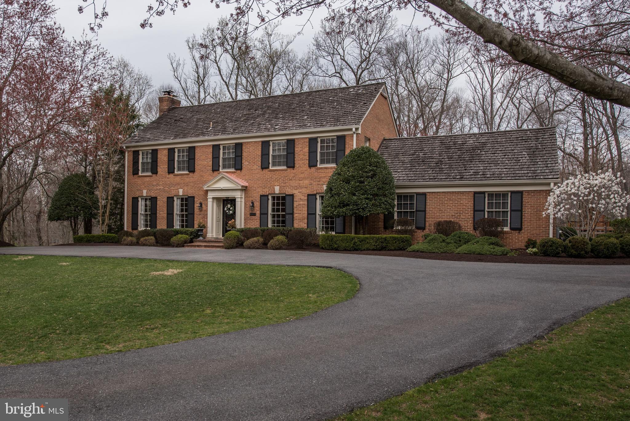 Classic, all brick, traditional center hall colonial w/stately setting on 2+ acres on private, quiet cul-de-sac in one of Potomac's most coveted communities. Amazing natural light throughout. Beautifully maintained, this home has exceptional room sizes and a wonderful floor plan- perfect for large scale, formal enteratining or casual get-togethers. A large flagstone terrace accessed from the Family Room or Kitchen offers an ideal entertaining spot during the summer months. If desired, the Chef's Kitchen could easily be opened to the Family Room. Many custom built-in bookcases incl. in the Family Rm, Master Suite and secondary bedrooms. The fully finished lower level includes a recreation room, exercise nook, "bedroom"/study and the utility/laundry room. An oversized two car, side entry garage plus a circular driveway offers lots of off street parking. Enjoy this ideal location just a few miles from Potomac Village and the Clara Barton Parkway. I-495 and I-270 are nearby as well as downtown Bethesda and Tyson's Corner. Make your move today. This is an exceptional opportunity to live in the prestigious Potomac Falls.