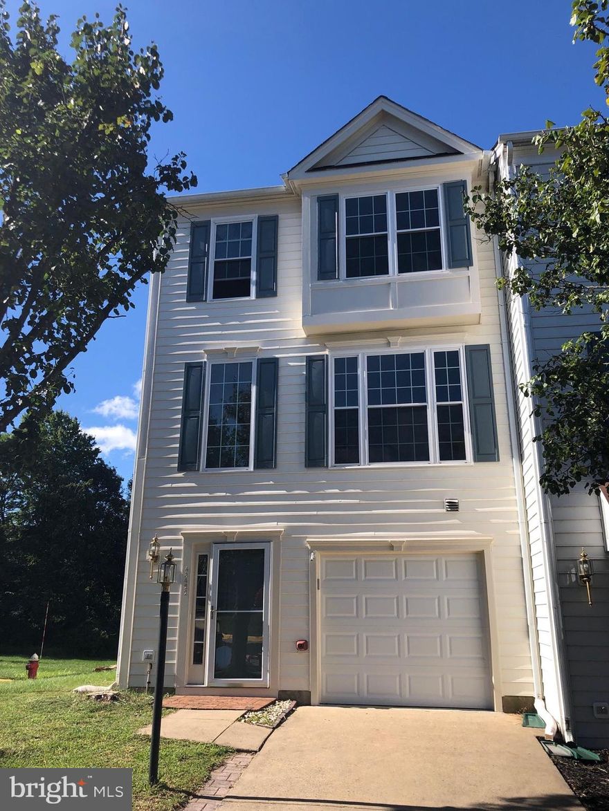 Spacious end unit Townhouse. 3Bedrooms, 3FullBath, 1HalfBath, 1 car garage with extra parking spaces.   approx 2100 sq ft finished End unit Town Home with 3 level Extension in Premium lot, back to trees. Hardwood floors on Main level, Deck & Patio, new vinyl plank, new washer & dryer, newer HVAC, newer Windows . 1.5 miles to Future Loudoun Metro Station and Rt.267,