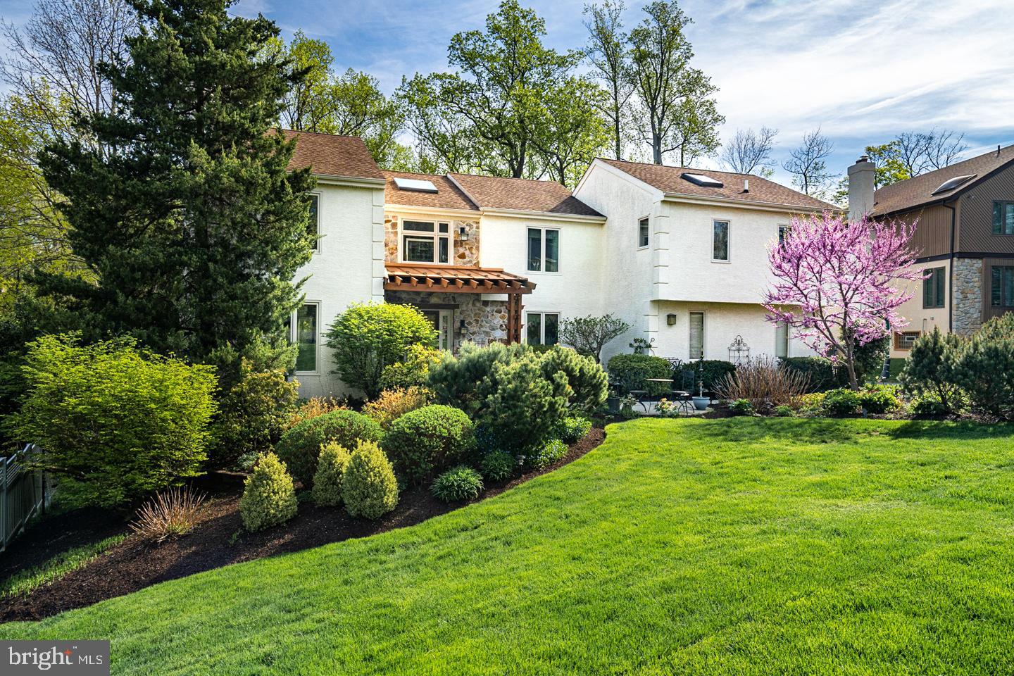 Welcome to this beautiful 5 bedroom 4 1/2 bathroom home on a quiet cul-de-sac in Bryn Mawr.  This home has been extensively renovated.  This  first floor includes a beautiful entry and dramatic staircase and sky light.  The living room is off of the entry and is separated by two large custom built-in cabinets to a formal dining room. The kitchen has a breakfast room that has sliding doors to a massive deck with a large 3 season  gazebo for wonderful outdoor entertaining.  The kitchen has ample room for any chef.  There is a family room off of the kitchen with a  vaulted ceiling, large built-in cabinets and gas fireplace.  The 2 1/2 car garage enters into a large mud room with ample closet space and  2  work stations.   There is a first floor powder room.  The second floor has a primary suite with a large walk-in closet and updated en suite bathroom, plus a large anteroom presently being used as an office.   There is a large guest room with private bathroom( which has a bathtub ) as well as 2 other bedrooms and 1 additional bathroom on this level. Extensive attic storage is accessible via pull down Bessler stairs. There is a laundry room on the second floor. The walk-out basement has been totally finished with a wonderful T.V. room, bedroom and fully-renovated bathroom.  This lower level also has an artist studio, wood shop and storage room. The  outdoor area is beautifully landscaped with mature trees and shrubs for great privacy, with a complete in-ground sprinkler system and fenced-in back yard. This house has a generator.