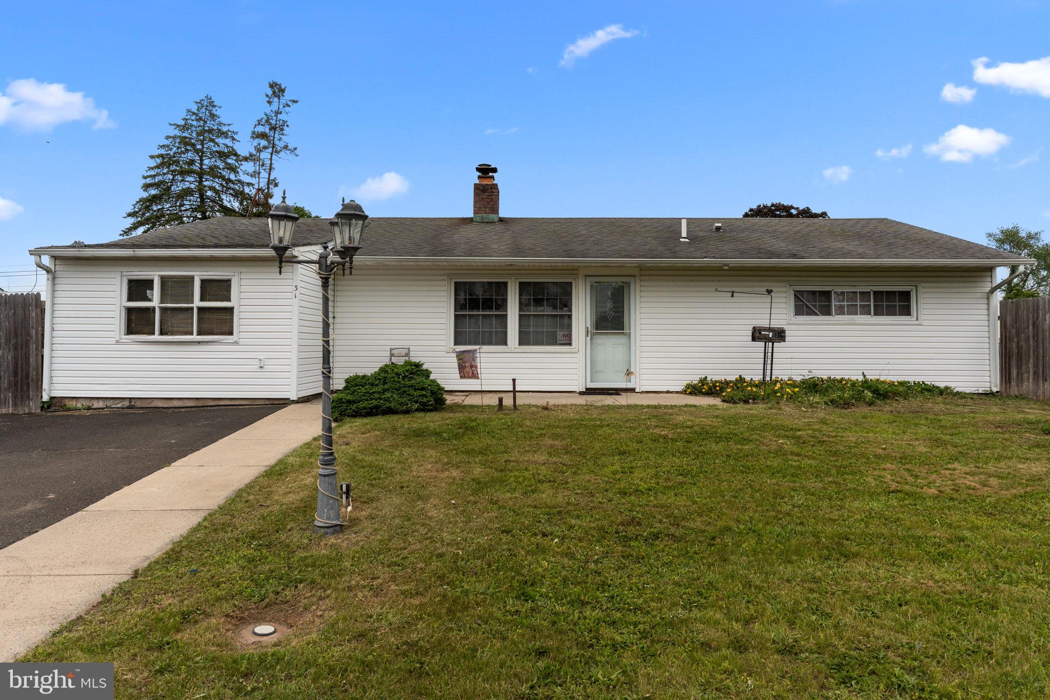 Just what you've been searching for! Add a little TLC and build instant equity! Located within the sought after Pennsbury School District, this expanded 4-bedroom 1.5 bath ranch on oversized corner lot is waiting for your vision! Major improvements have already been completed, including replaced roof, maintenance free vinyl siding, replaced windows, and interior floor slab plumbing and exterior sewer line have been replaced! Interior features eat-in kitchen with ceiling fan, two large double hung windows for natural lighting, stainless French door refrigerator and dishwasher, and electric range. Living room features exterior door to rear patio, original 3-sided brick fireplace, built in bookcases and 2 large windows. You'll love the 18'x25' rear addition with exterior door to rear yard, vaulted ceilings, ceiling fan, wood bead paneling and half bath with ceramic tile floor and pedestal sink. Laundry area off of addition. The original carport has been converted to main bedroom and features a walk-in closet, ceiling fan and door to side yard. Three additional bedrooms and hall bath with ceramic tile, replaced toilet & tub with fiberglass insert, and tri mirror medicine cabinet. Exterior features replaced roof, maintenance free vinyl siding, replaced windows and exterior doors, and 4 car macadam driveway with cement service walk. One of the best features of this home is it's rear yard which features a 6' pressure treated wood privacy fence which extends all the way to the sidewalk, the 16'x20' cement patio with footers great for summer socializing or relaxing, a vegetable garden. Extras include replaced heater with two-zone hot water baseboard, pulldown attic stairs in hallway (attic has flooring and extra blown in insulation and replaced six panel doors throughout. Close proximity to Falls Park and community pool, NJ bridges and Levittown train station. Considering the separate side entrance, the addition lends itself to the possibility of becoming an in-law suite by converting the half bath to a full. Take a look and make an offer.
