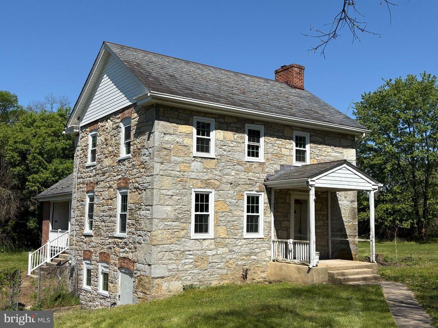 Nestled near the PA & Maryland state line this exquisite historic Colonial residence, built around 1768, stands as a testament to timeless craftsmanship and architectural elegance. Set on a 12.38-acre lot, this home offers a unique blend of historic charm and modern convenience, making it a rare find in today's market. As you approach the property, you'll see the large bank barn which was built in 1930 and still stands strong. The homes striking brick and stone façade invites you in, hinting at the rich history that lies within. As you enter the home you will see that the interior is a work-in-progress, the current owners had intentions of finishing the interior however they have decided that it would be better for a new owner to complete the process to their liking. The exterior is in great condition, the windows have all been replaced and septic system is brand new. The roof is a slate shingle and it appears to be in very good condition. The home has a brand new HVAC system providing efficient heat and cooling. On the main floor you will find a spacious layout, it is an open canvas that would allow for a beautiful kitchen, dining area and large living area. Upstairs the home features three bedrooms, providing ample sleeping space and a full bathroom. The unfinished basement has a Vernal spring that flows on occasion and is home to the water heater and updated plumbing service. Outside, the expansive grounds offer a serene escape from the hustle and bustle of everyday life. Imagine sipping your morning coffee on the porch, surrounded by lush greenery and the gentle sounds of nature. The property's generous size provides ample room for horses, cattle, outdoor activities, gardening, or simply enjoying the tranquility of your own private oasis. This remarkable property is not just a home; it's a piece of history waiting for its next chapter. With its unique design, rich craftsmanship, and expansive grounds, this Colonial gem offers a rare opportunity to own a slice of the past while enjoying the comforts of modern living. Don't miss your chance to experience the charm and elegance of this extraordinary residence.
