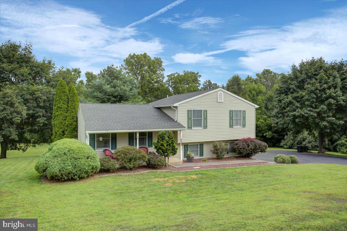With a little over an acre of land back a private road, this split level home with a wooded backdrop is sure to delight! The main level offers a spacious living room and a combined kitchen/dining area that leads to an awesome back deck! On the upper level you will find the primary suite complete with its own full bathroom! The other two bedrooms are a generous size and there is a spacious full bathroom off the hallway. The lower level has a one car garage, some unfinished storage space, and also the laundry/utilities. This home truly becomes impressive as soon as you step outside. The wooded backdrop is amazing with many mature trees and a relatively flat acre lot. The deck is perfect for entertaining and super stylish with a cathedral pine ceiling to shield from rain and a fan to keep the air moving! There is a fenced area perfect for a dog run and plenty of parking for all those outdoor parties you are about to host! Also don't miss the recent upgrades like a new well pump (June 2025) and brand new roof (July 2025). Seller prefers to close end of Sept when their new construction is set to be complete or would entertain a rent back situation. Schedule your tour today! Offer deadline of Friday, August 8th at noon.