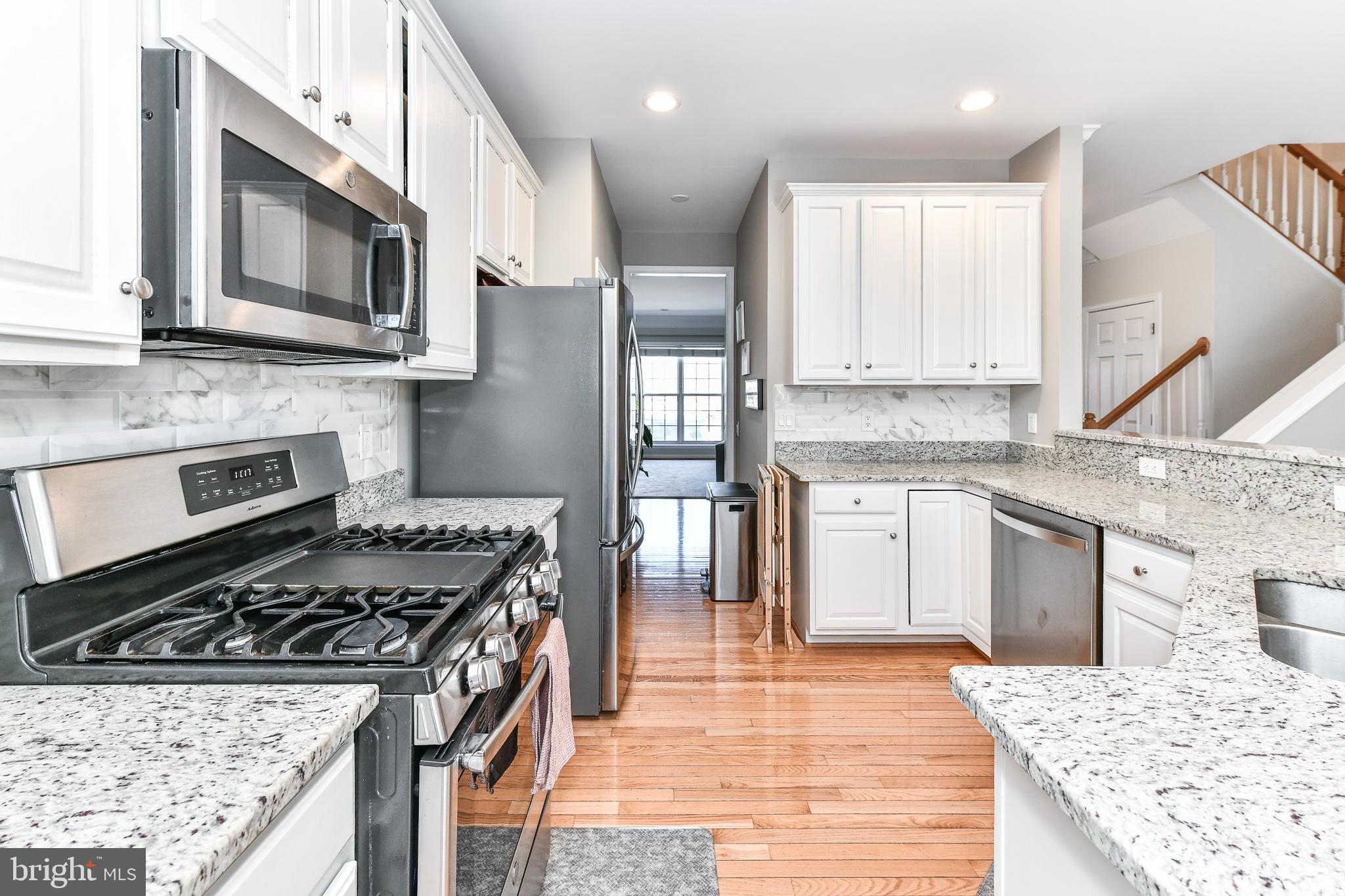 A Commuter's Dream - Luxury 3BR, 2FB, 2HB townhouse is just steps to the Vienna Metro*Beautiful hardwood floors, recessed lighting, upscale moldings & trim, & lots of natural light in each room of the main level*Spacious living & dining room leads to Kitchen featuring ample white cabinetry space, granite counters, complimentary subway tile backsplash & stainless steel appliances*Kitchen breakfast area with sliding glass doors leading to deck*Family room off kitchen with plantation shutters & fireplace could also be used a dining area*Upper level primary bedroom is spacious featuring tray ceiling with fan, walk in closet & large white on white ensuite bathroom with dual vanities, separate shower & soaking tub*2 additional nicely sized rooms upper level share full bath*Fully finished walkout lower level with full bath, rec room, fireplace & sliding glass doors to walk outside*Enjoy private, fenced patio*2 car garage*Excellent location*Walking distance to METRO*Easy access to major routes I-66, I495, Routes 50 & 29*Quick 5 minute drive to shopping, restaurants & theatre in Vienna or the dynamic Mosaic Center*