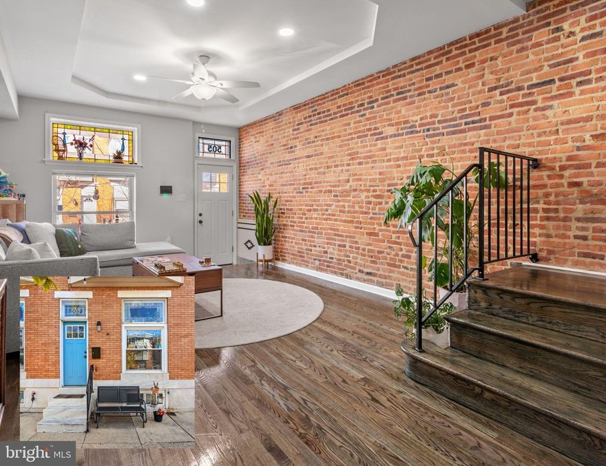 There’s something especially appealing about a home that gives you options. At 505 S Lehigh Street, a recent refresh brings a clean, move-in-ready feel, paired with a seller offered $5,000 credit for a full-price offer. Buyers may explore applying it toward allowable financing options like an interest rate buy-down—which could help dramatically reduce monthly payments depending on loan terms—or toward closing costs.

Inside, the main level opens up beautifully, with exposed brick adding warmth and character against a bright, airy layout. The space is large enough to hold a dining area, or utilize an eat-in kitchen moment. The kitchen anchors the space, designed for both everyday living and the kind of casual hosting that doesn’t require much effort. A half bath and generous storage round out the floor, while just beyond the back door, a private patio strung with lights sets the tone for dinners outside as the seasons shift.

Upstairs, two large bedrooms offer comfort and breathing room, while a third flex space adapts to what you need—a home office, guest room, or additional bedroom. The full bath is centrally placed, practical and accessible.

The lower level adds a layer of versatility that’s hard to find. Whether it becomes a cozy movie space, a tucked-away guest suite, or a fourth bedroom, it’s supported by a full bath and walk-out access, giving it a sense of separation that works well for longer stays or shared living. This secondary living space could easily host your O's opening day kickoff with the walkout access from the basement to your grill.  

And then there’s the neighborhood—Greektown in its most lived-in, everyday rhythm. Street parking is easy, neighbors are out walking their dogs, carrying groceries in, waving as they pass. Greek Fest just a few blocks away brings a sense of tradition and energy that anchors the community in a way that feels both vibrant and familiar.

It’s a home that gives you options, yes—but more than that, it gives you a place to settle into, stretch out, and make your own.