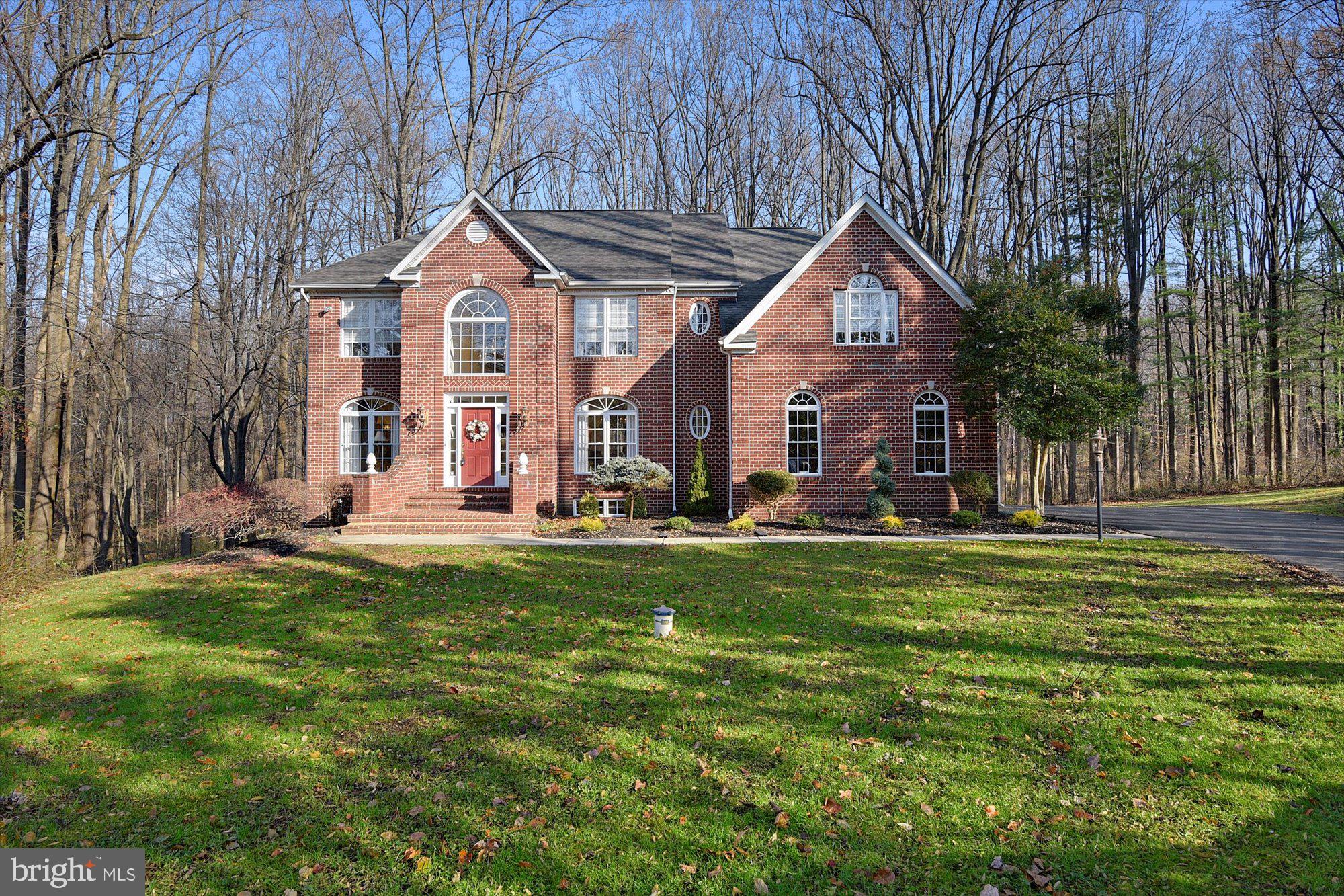 Welcome home, stunning center hall colonial located in a picturesque private setting. If location is important there will be no need to scroll further, this home is ideally situated on private lot in Fork, Maryland. The small community of about two dozen upscale homes on generous lots is surrounded by woods. Most of the lots are partially wooded with mature trees creating a park like setting and the perfect reward after the days commute! Ideally located just off Harford Rd only minutes from route 1, Towson and 695. Striking brick front exterior and soaring two-story foyer with unique sightlines and the ideal open floorplan. Beyond the formal living room and generous formal dining room the foyer opens to a grand two-story family room with a wall of windows overlooking the private rear yard. Large kitchen with island and stainless-steel appliances. The upper level boasts a huge master suite with spa inspired bath, two walk in closets and a sitting room. The other three bedrooms are generous in size and the shared hall bath boasts a dual vanity. A large laundry room completes the upper level. The lower level is an entertainer’s delight, featuring a large rec room and custom bar. Rich wall treatments and fashionable fixtures provide visual appeal.