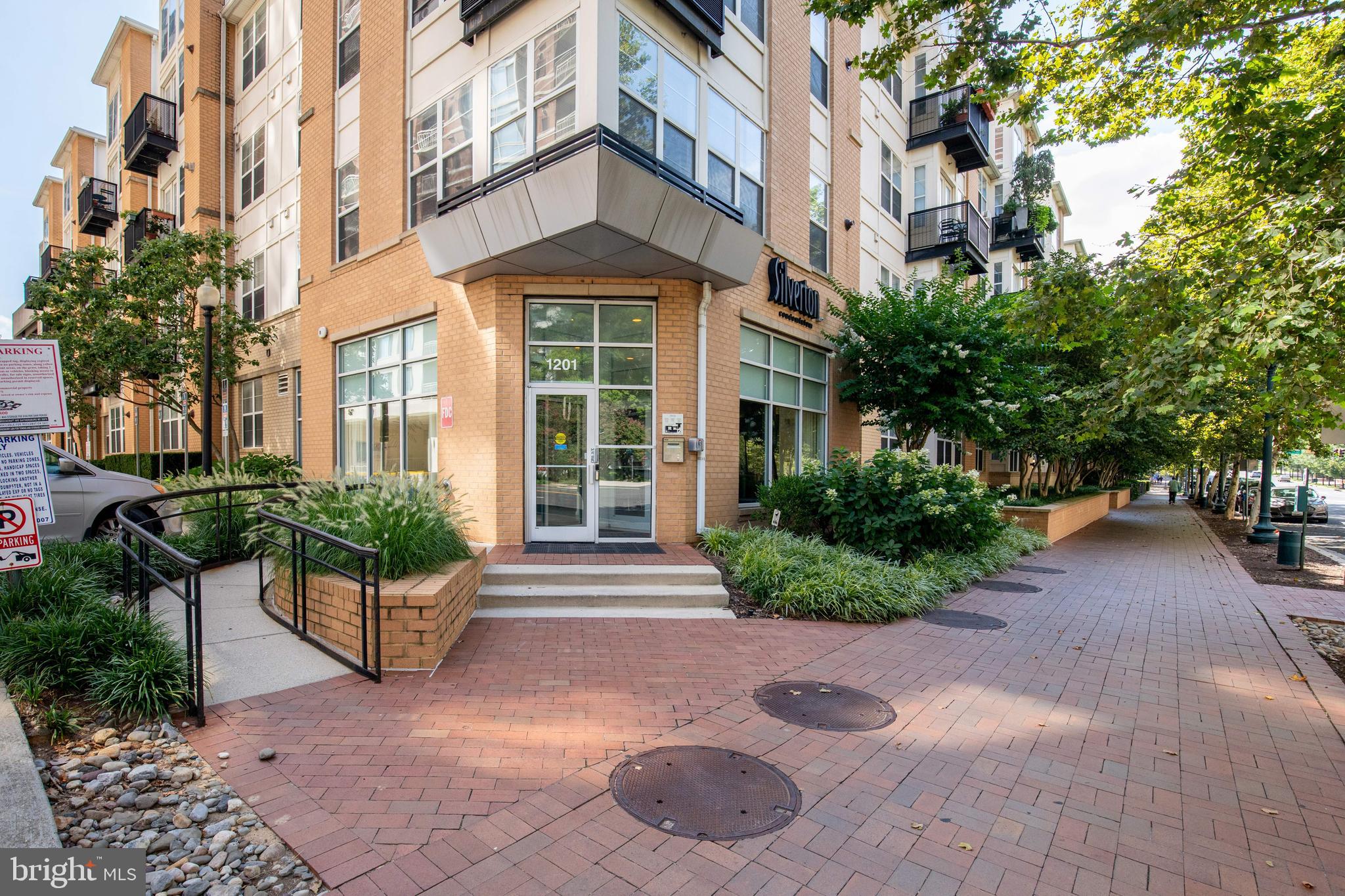 Prime downtown location! Modern condo in amenity-rich building with open layout, updated flooring, kitchen, and in-unit laundry. This 823 sq ft condo is light filled features open living room with balcony overlooking the pool. Fresh kitchen with stainless appliances, and ample cabinets. Spacious bedroom with large walk-in closet. 1 garage parking space included. Silverton Condo Amenities include dog run, gym, pool club room, and staffed lobby. Located across from Giant, CVS, Starbucks, and more. Just mins to Metro and downtown Silver Spring. Available now. One pet considered with $25/month pet rent. Non smoking.