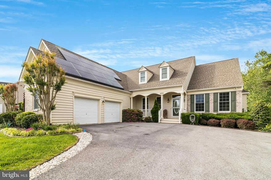 Welcome to your dream home in the coveted neighborhood of Hanover on Breton Bay, where luxury meets tranquility. This exquisite residence, built by renowned custom home builder P.F. Summers, boasts extensive landscaping and a side-load garage that creates a charming courtyard feel, enhancing its statuesque appearance and exceptional curb appeal.

Enjoy water access with a community pier, boat ramp, and boat slips, along with a recreation area, tot lot, and pavilion for family gatherings and leisure. The open floor plan with high ceilings invites abundant natural light and a spacious, airy atmosphere. Extensive trim work and custom touches throughout the home reflect the superior craftsmanship of P.F. Summers.

The first-floor master bedroom is a true retreat, featuring a generous walk-in closet. The luxurious master bathroom offers a separate shower, a walk-in therapeutic tub, double bowl sinks, and ample lighting. A large sunroom at the rear of the home provides a perfect spot for relaxation, while an enclosed porch, previously used as a plant room, adds versatility to the living space.

The kitchen is a chef's delight with an upgraded breakfast bar and high-end appliances. Hardwood floors grace the foyer, dining area, and breakfast area, adding warmth and elegance. Adjacent to the kitchen, the family room features a cozy gas fireplace, ideal for gatherings and cozy evenings.

The oversized garage offers ample space for vehicles and storage. Upstairs, you'll find two additional bedrooms, a fully upgraded bathroom, and a large plywood-floored storage area over the garage, perfect for conversion into additional living space. This home combines luxury, functionality, and a prime location, making it a rare find in Hanover on Breton Bay. Schedule a viewing today and experience the charm and sophistication of this stunning property.