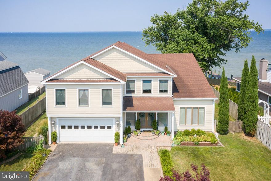 It’s the lifestyle you deserve …… in this beautiful Chesapeake Bay waterfront! Walk into the front foyer and you will instantly see spectacular views of the Chesapeake Bay through the bayfront wall of windows. Inviting home, featuring a formal dining room with vaulted ceiling, 4 bedrooms, plus 3.5 baths, two master suites waterside, Brazilian Cherry hardwoods & Carrara marble floors, 3,800 finished square feet. Original house was remodeled 2004 with a major expansion. A well-built 150-foot pier, professional landscaped, and hardscaped yard. Close 8-mile commute to the bay bridge & stores. Community has a boat ramp, two beaches, and a community playground. This community is in the process of installing public sewer, there will be an assessment fee associated with this (please see disclosures online). This gem is a must-see!