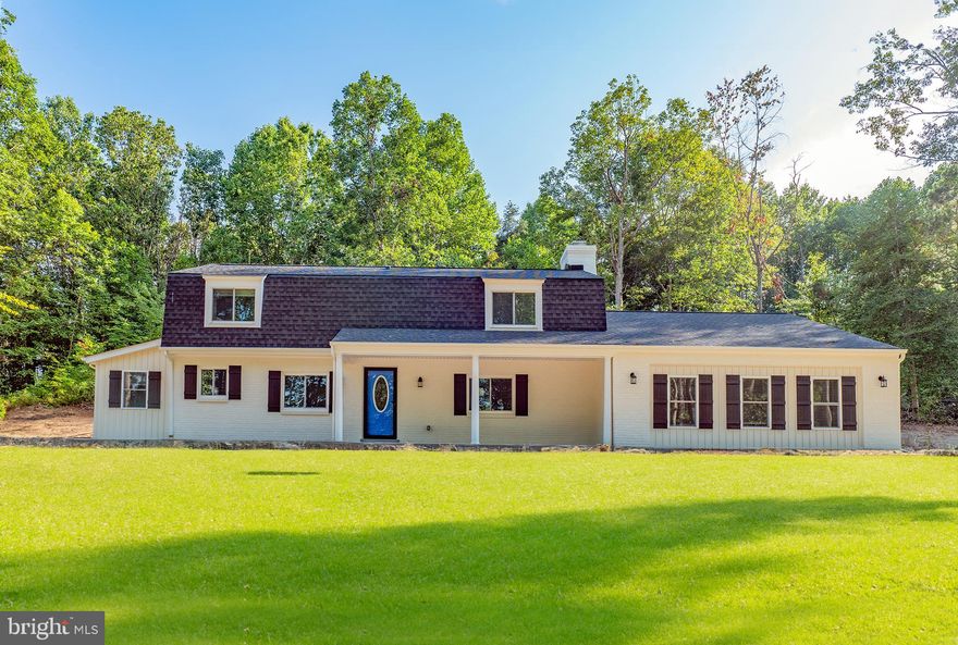 This one has been completely redone all the way down to the studs! Step inside the foyer and you will be greeted by gleaming hardwood floors found throughout the main level, brick fireplace, gourmet kitchen, primary bedroom, half bath and laundry room. The primary bedroom is located on the main floor and features a massive walk-in closet, ensuite bathroom with an enclosed glass & ceramic tile shower, double vanities, custom built in storage space and double shower heads. Stainless steel appliances are found in the kitchen.  The brand new kitchen has a granite island with extra storage space, custom lightening, 36 inch cabinets, granite counters and a MASSIVE walk-in pantry.  The curve rod iron staircase leads to 2 large bedrooms each with their own bathrooms and ample closet space. 3 wooded acres add just the right amount of privacy to enjoy the back and front yards.