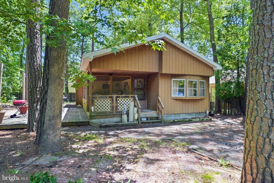 Escape to your own private beach retreat! Nestled on a peaceful wooded lot, this  3 bedroom, 2 bath ranch offers the perfect blend of relaxation, convenience, and coastal living. Whether you're looking for a full-time residence, weekend getaway, or investment opportunity, this home is move-in ready with a newer HVAC system (2022) and new roof (2024) already in place.

Spend your days soaking up the sun and exploring Delaware's beautiful beaches, then return home to unwind in your tranquil wooded setting. With comfortable one-level living and plenty of space for family and guests, this home is the perfect place to rest your head after a day on the beach.

Ideally located just 10 minutes from Bethany Beach, 20 minutes from Dewey Beach, and 20 minutes from Ocean City, you'll enjoy easy access to some of the area's best dining, shopping, entertainment, and waterfront attractions.

The best part? No land lease here, you own the home and the land, giving you the freedom, value, and peace of mind that coastal buyers are looking for. Don't miss this opportunity to own an affordable beach getaway in a prime location!