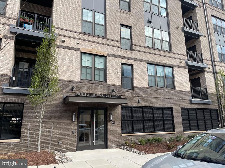 Welcome to this amazing 2 bedroom 2 bathroom condo plus den/office home at Metropark at Arrowbrook.  This is  where elegance meets convenience. This stunning home features modern finishes and engineered wood floors throughout.   At the heart of this beautifully cared for home is a spacious kitchen, featuring luxury white cabinetry, quartz countertops, stainless appliances including a gas cook-top, wall oven, built in microwave  and with seating for four, an oversized island.   This gorgeous kitchen opens to the warm and inviting living room which extends to the spacious balcony for relaxation to unwind.  Additionally, this home has an owner's suite with an oversized bedroom with it's own private bathroom.  The second bedroom is spacious with access to the hall bathroom. You have one assigned parking space with dedicated EV charging in the garage along with additional parking outside the garage.  Easy access to a dog park, sports fields, playground, and the Innovation Center Metro Station. Shopping minutes away, plus, quick access to major roads ensures seamless travel and connectivity to the surrounding areas.