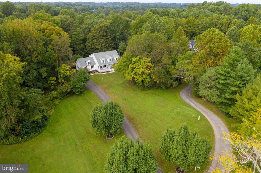 If you are looking for that perfect  farm house , This is it ! Situated on 5.22 acres this home features over 3400 finished sq ft.   4 bedrooms, 3.5 baths, and 2 office spaces, over sized attached 2 car garage with lots of storage . Open main level floor plan, finished walk out  lower level . The kitchen has just been renovated with beautiful white cabinets, granite, large center island,  dining area  open to living room ,walk out screen porch  and gorgeous 5 inch hardwood floors thru out the main level and stairs.  Upper level  laundry,  Huge master suite with walk in closet and updated master bath.  Updated Hall bath and new carpet in bedrooms . and  fresh paint The lower level has a full bath, bedroom #4, space for a office or game room and family room with bar Lower Level walks out to the hot tub.  Full house generator, additional detached garage/workshop, shed, all on a private road with only 4 homes .  Northern Calvert Location, 45 minutes to Washington DC, Baltimore, 30 minutes to Annapolis,