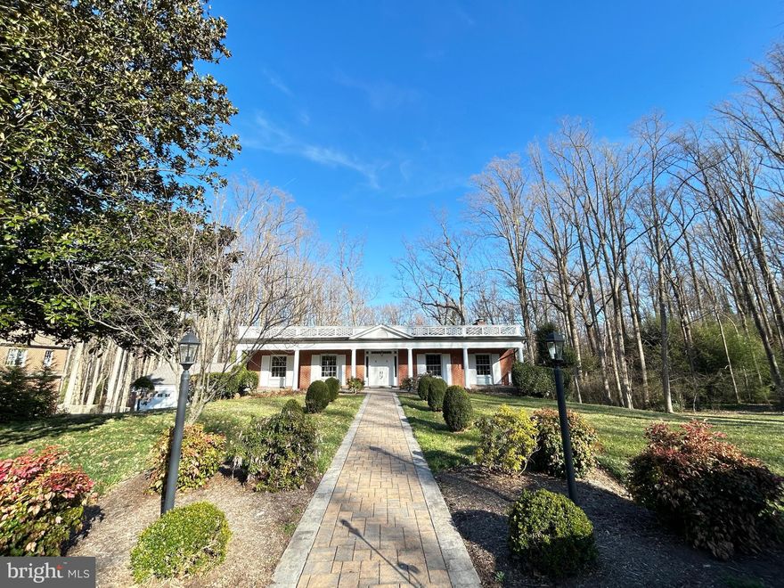 Nestled in McLean’s exclusive Old Georgetown Estates, this remarkable 6-bedroom, 3-bath residence sits on a private, beautifully landscaped 1-acre lot backing to tranquil, mature trees. Enjoy the ease of one-level living, highlighted by elegant hardwood floors, classic moldings, and two cozy fireplaces. Step from the living room onto a spacious Trex patio for seamless indoor-outdoor flow and gorgeous views. The expansive walk-out lower level, bathed in natural light, leads to a large patio—ideal for outdoor entertaining or serene relaxation. The property includes a detached two-car garage with a convenient pull-down attic for additional storage, plus extra parking spaces. Situated near three McLean Metro stops—downtown McLean, Tysons Corner, and Rt 7—this location offers effortless access to I-495, I-66, Route 267, and Dulles International Airport. Families will value the home’s inclusion in the prestigious Langley High School pyramid, feeding into Spring Hill Elementary and Cooper Middle. Notable updates include a 5-year-old roof, furnace and hot water heater (5-7 years old), durable Marvin windows, and a generator installed in 2001. This inviting property provides privacy, ample space, and unparalleled convenience in one of McLean’s most distinguished neighborhoods. Seize this rare opportunity! ***FRESHLY PAINTED***