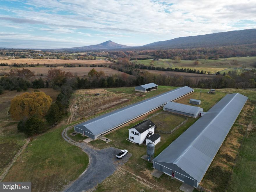 Welcome to the pristine and picturesque Quiet Retreat Farm located only seconds east of historic New Market and Interstate 81. Prime land like this won’t last long so don’t miss your chance to own this gorgeous farm. Expansive acreage that stretches from US-211 to Smith Creek Road. This one of a kind offering features frontage with lovely Smith Creek of more than 2000 ft +/-. The vast majority of the stellar land is open and fenced for livestock. This farm features two large well maintained livestock or poultry barns, equipment shed, milking parlor, and living quarters. The quaint living quarters feature 3 bedrooms, two bathrooms,  and 1600 +/- square feet of living space. Both barns are equipped with water and electricity throughout. With 5 individual parcels this property has multiple building opportunities. Elite panoramic views of the surrounding countryside can be seen from the higher elevations of the farm year round and access is secured via road frontage on US-211 and Smith Creek Road both of which are state maintained asphalt roads. Prime hunting opportunities for deer, turkey, and small game. Zoned Agriculture (A-1) with gently sloping topography.  Terrific location for your farming operation, family compound, or development project. Live the way you want with no restrictions, no covenants, and no HOA. Enjoy hiking, camping, and recreation of all types on this land. Land and all structures will convey in strictly AS-IS condition. A short drive to all the amenities and attractions Harrisonburg has to offer. Shown by appointment only and ALL buyers must be accompanied by a licensed agent.