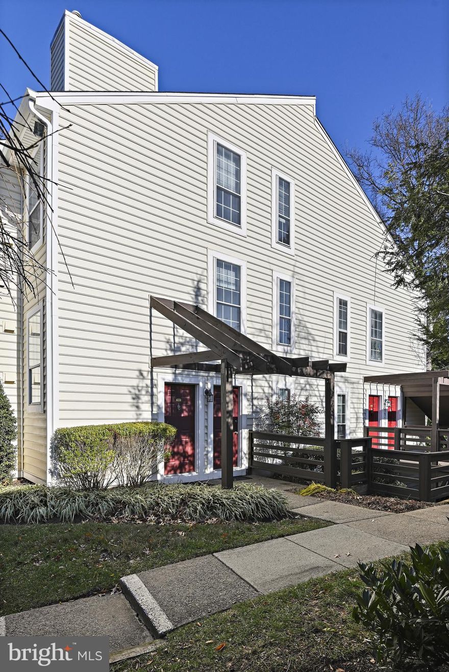 Situated in the heart of sought-after Oakton, this two-level condo offers a perfect blend of modern upgrades, a functional layout, and a private entrance. The 2-bedroom, 2-bathroom design features an open-concept floor plan with vaulted ceilings, neutral tones, and an abundance of natural light. The living room includes built-in storage, a wood-burning fireplace, and sliding doors that open to a large covered deck..
The remodeled kitchen offers a practical layout and is bright with refaced cabinets, a gas range, a dishwasher, and a refrigerator. A tall double-hung window floods the space with natural light, while a pass-through to the dining area enhances the open feel. The main level also includes a spacious bedroom with serene views and a fully renovated bathroom featuring a frameless shower door, updated vanity and toilet. The utility room, complete with a washer, dryer, and luxury vinyl plank flooring, adds convenience.
Upstairs, the loft-style bedroom/office is both spacious and versatile, with recessed lighting, a ceiling fan, and a walk-in closet with built-in shelving. The ensuite bathroom offers a modern and private retreat with thoughtful updates.
Community amenities include a pool, playground, and easy access to nearby parks such as Blake Lane Park, which features a dog park, and Borge Park, complete with a playground. With open parking, two permits per household, ample visitor parking, and a pet-friendly policy, this condo offers both comfort and convenience. Ideally situated near I-66, Route 123, and the Vienna Metro, it provides seamless access to shopping, dining, and entertainment options.