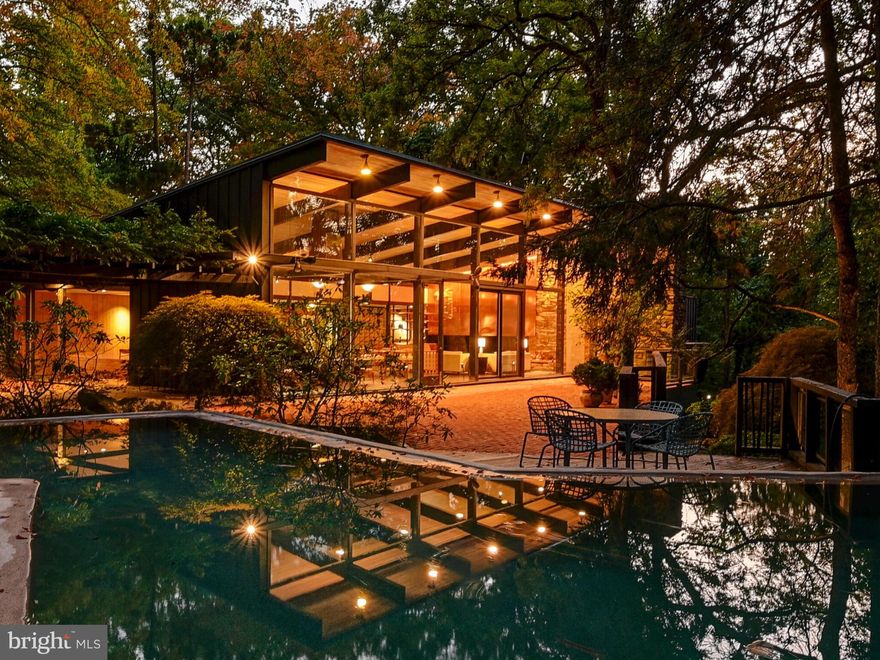 Offering two separately deeded dwellings on one 2.14 acre site, each with their own pool.   A Mid Century Modern Masterpiece, the main dwelling was built in 1956, inspired by its surrounding landscape, as crafted by famed landscape architect, James Rose - a major force in the design of the home as well.  The property borders the Jones Falls Trail, which extends from the Inner Harbor to the nearby Cylburn Arboretum. In 1961,  the property was awarded House and Garden's annual Hallmark designation which honors the country's best residential design of the year, commending the relationship of house and garden,  noting "it is hard to tell where one begins and the other ends."   This mid century work of art winds in and around its woodland site with layers of terraces, outdoor play and entertainment venues and water features, including an in-ground pool and open air fish pond around which the house revolves. Walls of glass invite the outside in, providing lovely views from this hilltop perch.  Nearly 5,200 sf on one level.  An open concept floorplan (still in vogue!) offers living and dining spaces enhanced by the soaring roofline and multiple access points to the expansive patios, including one to the rear of the home which flows from the generous family room/playroom. The original kitchen is as welcoming to a gourmand today as it was in 1956 - including the Alberene soapstone counters and well maintained cabinetry.  Five bedrooms and 5 1/2 baths.  Within walking distance to charming Mount Washington Village with its many shops and restaurants, and convenient access to I-83.

The property has witnessed additional development in the succeeding years. The owner's desire for a separate  space led to the 1971 creation on an adjacent separately deeded lot of an integrated yet private getaway (2309 Cross Country Boulevard).  An open concept design, the "Studio",  offers 1,200 sf of casual living and work spaces, including a fireplace, kitchen and full bath.  In 1991 a 1,900 sf  domed indoor pool  house  was added with amenities such as a kitchenette and a shower room. A Perfect opportunity for a remote office, inlaw dwelling or guest house.  True to the original  concept of the property, harmony with the woodland landscape is afforded with patios and terraces.  Qualified buyers, only, please.  ESTATE SALE - AS IS.
Sale includes Tax Id#'s 27-17-4675F-044 and 27-17-4675F-041.