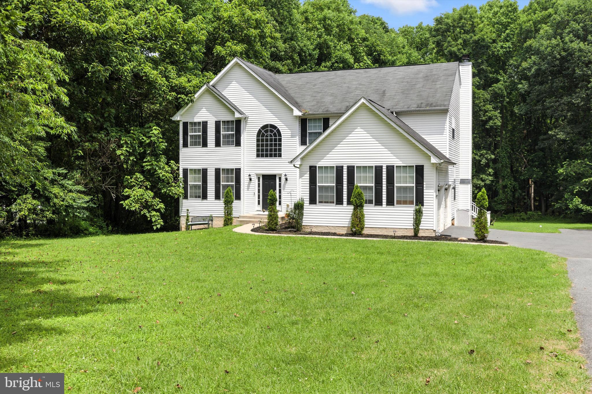 Beautiful colonial home in Reisterstown with over 3.0 acres of secluded land. that offers an abundance of natural beauty and wildlife. Many updates include, new well pump 2 years, Vivint alarm system, expanded driveway, new garage door openers 3 years, new washer & dryer, new dishwasher (to be installed), built-in shelving. Main Level features formal living and Dining rooms, updated airy kitchen with center island and granite counter tops, ceramic tile flooring, opens to an inviting family room with wood burning fireplace, there is also a private main level office. Upper level offers a chic primary suite with ample closet space and updated bath. 3 additional spacious bedrooms and full bath. The fully finished lower level offers an exercise room, bright over-sized family room with another full bath and outside entrance. There is a side load 2 car garage with built-in shelving for storage, trek deck along the entire rear of home over looking the expansive back yard, a nature lovers dream!