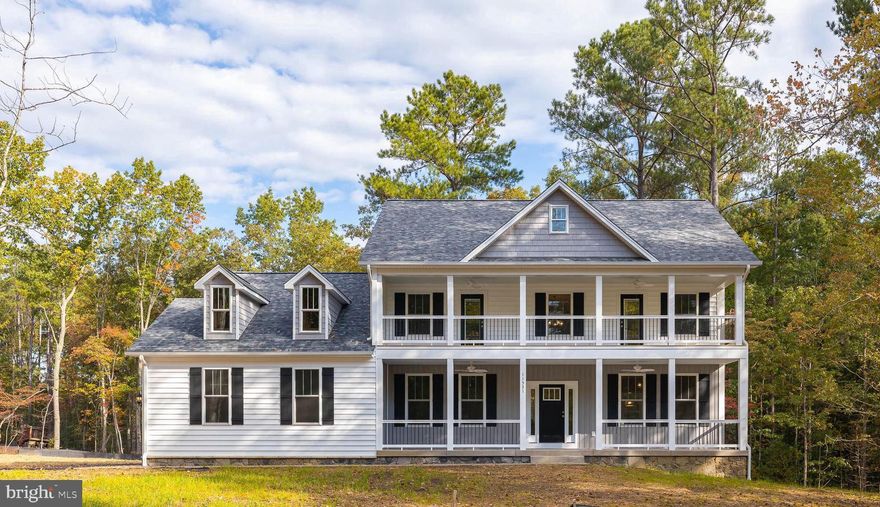 Surrounded by woods the setting is truly picturesque!  4 bedrooms plus lower level office, 3.5 baths, family room with hardwood, office, formal living room and dining rooms with hardwood, kitchen with island, stainless steel appliance package hardwood floor, breakfast area with entry to rear 12*16 deck, family room with gas burning fireplace, powder room with hardwood floor, and mudroom/laundry with tile floor. Upper-level master suite has a huge closet with a second laundry area with tile floor, mop sink and folding table, three additional rooms with carpet, hall bath with tile floor. Both full baths have custom tile work. Basement with full bath and room. Pictures are of another home. Delivery is July! Currently have a one level model available too. Price is base with certain options.