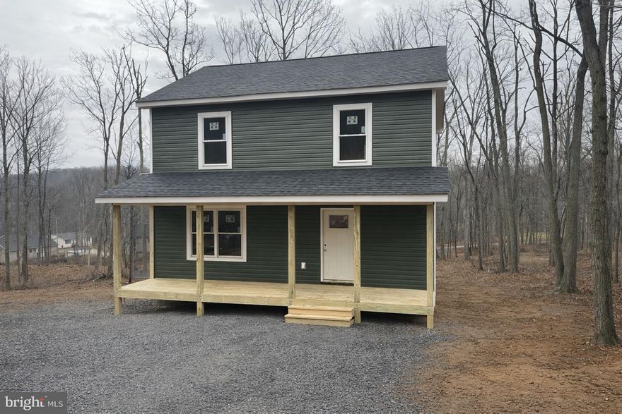 Brand-new construction in the Wilde Acres community of Frederick County! This newly completed 3-bedroom, 2.5-bath Colonial-style home offers approximately 1,512 finished square feet across three levels and sits on a spacious 0.25-acre lot. Designed for modern living, the main level features an open-concept layout with luxury vinyl plank flooring, a bright kitchen with pantry and upgraded countertops, a dining area, family room, main-level laundry, and a convenient half bath.

Upstairs, the primary suite includes a walk-in closet and private full bath with double vanity, along with two additional bedrooms and a second full bath. The unfinished basement provides excellent potential for future living space, storage, or a home gym.

Listing photos are from a similar, completed home by the same builder and are for reference only.

Enjoy peaceful rural living with paved HOA-maintained roads, a covered front porch, and a rear deck (10x10 to be built), all just a short drive from Winchester and commuter routes. With low annual HOA dues covering road maintenance, this move-in-ready new construction home offers comfort, privacy, and room to grow.