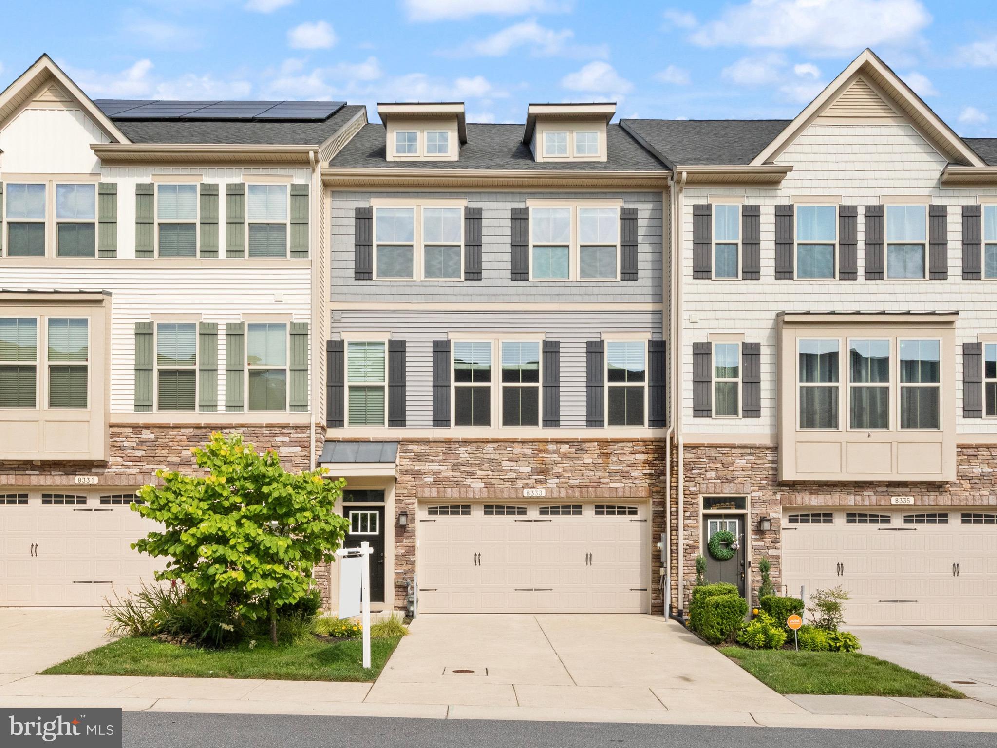 Rarely available and loaded with premium selections, this 3 bedroom, 3.5 bath townhome was built in 2018 and is located in the sought-after Pondview community in Millersville. Offering 2,680 square feet of finished living space across three levels, this home exemplifies open concept living at its best. The main level features a chef’s kitchen with an oversized granite island and pendant lighting, a spacious living room with a thermostat-controlled gas fireplace, a generous dining area, and a built-in office nook enhanced with matching wall cabinetry—an impressive upgrade offering abundant and convenient storage space. A stylish half bath, hardwood flooring throughout, and 9-foot ceilings complete this level. The expansive lower-level flex space opens directly to a backyard with peaceful wooded views and no rear neighbors—plus, lawn care is handled by the HOA for low-maintenance living. Direct access to the garage and an additional full bath with granite is also located on this level. Upstairs, you’ll find three bedrooms, including a luxurious owner’s suite with a walk-in closet and a beautifully appointed ensuite bath. The ensuite features a dual-sink granite vanity, a private water closet, and a separate shower. Another full bath and the laundry area are also conveniently located on this level. Additional highlights include an on-demand tankless hot water heater, window treatments throughout, a spacious 2-car garage, and access to incredible community amenities such as a pool, fitness center, tot lot, clubhouse, and Pond View Park with walking trails, a pavilion, dog park, fishing pond, and pier. All of this in a prime location with easy access to Baltimore, Washington D.C., Annapolis, and Fort Meade. Welcome home!