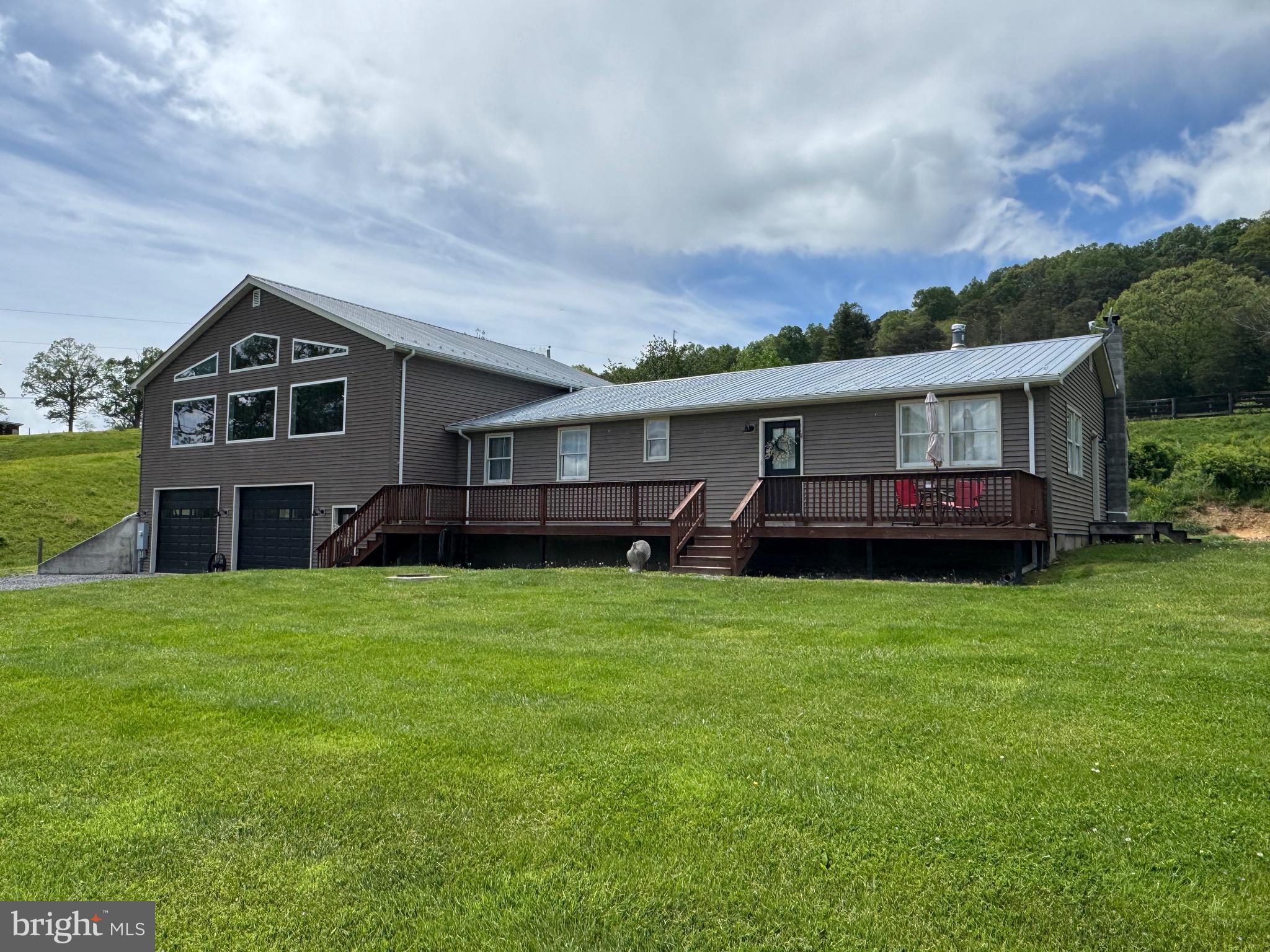 Don’t miss this Awesome opportunity on this enormous country home. The home offers four bedrooms and four baths, three of the bedrooms have their own En-suite private bathrooms. Large kitchen with eat at bar and stainless-steel appliances and pellet stove. Main floor laundry room. Main floor tiled full guest bath. Large dining room. Incredible Family Room, loaded with windows and a stone floor to ceiling fireplace. Recent upgrades include a New Well Pump and Pressure Tank and water heater. Hardy Net Fiber Optic service available. Primary bedroom with tiled bath and two closets. Front deck with rolling pastoral views. Covered shelter area. Enormous 39’x31’ attached garage.