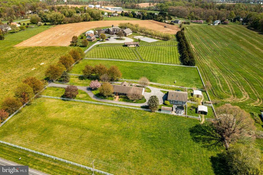 Nestled at 10 Webster Lane in Oxford, PA, this captivating 4.1-acre farmette in Upper Oxford Township offers an idyllic rural retreat. Boasting a sprawling ranch-style residence, horse stalls, 42 x 40ft accessory building with 4 horse stalls, 20 x12 Storage shed and turnout sheds, this property presents a unique opportunity for tranquil country living.

Please see the 3D tour and Video tour in this beautiful listing.

The residence features three spacious bedrooms and two and a half baths, accompanied by an attached two-car garage for convenient parking. The main floor welcomes you with a generously-sized eat-in kitchen, a formal dining room, and a cozy living room enhanced by a fireplace and wood stove insert. The primary suite indulges with its private bath, while two additional bedrooms and a hall bath provide ample accommodation and plenty of lighted closet space. Practical amenities include first-floor laundry and a powder room.

The kitchen is a chef's delight, showcasing upgraded Granite countertops, a double sink, an electric range, built in microwave, and stainless steel appliances. Recent enhancements such as newer luxury vinyl plank flooring add modern appeal to many rooms. Adjacent to the kitchen, a sunroom offers panoramic views of the surrounding pastures, creating a serene space for relaxation.  Stay compfortably cool in the summer with Central air and all rooms have ceiling fans for added circulation.

A full basement with bilco doors offers additional storage or potential living space. Access to the property is through a security gate, leading to a circular driveway for added convenience. The residence, constructed in 1995, blends brick and vinyl siding for enduring charm.

Outdoor amenities include a refreshing 15x30 foot above-ground pool, perfect for warm-weather enjoyment. Recent upgrades such as newer barn windows and a 2020-installed septic drainfield ensure the property's functionality and efficiency. A newer hot water heater, water system, and gutter guards contribute to low-maintenance living.

For the horses-the expansive pastures are level, open and encircled by eye catching white vinyl fencing.  There are  4 stalls with french drains, hot water, and 2 automatic watering systems.  Best of all, the farm is centrally located within a few miles radius to some of the very best equine veterinarians, trainers and horse show venues in the country!  Home is located right next to the Unionville Equine Associates 
Veterinarians!

Discover the allure of country living at this remarkable property, where modern comforts harmonize with rural serenity, creating an inviting haven for both relaxation and recreation.
Location is just north of Oxford with quick access to route 1, shopping, and all local ammenties.