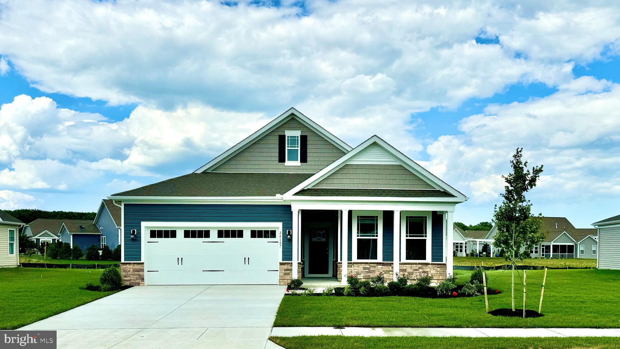 Welcome to 8740 Harper Way, a new home under construction in our newest community Gannon Range in Easton, MD. This 1,748 square foot, open-concept ranch home, offers two bedrooms, two bathrooms, 9’ ceilings, a flex room, a gas fireplace, and a two-car garage.
A welcoming foyer leads you to the spacious guest bedroom with a closet, the guest bathroom and a linen closet. The inviting flex room with stylish French doors is a versatile space with an abundance of natural light.
The home's well-designed kitchen features classic white cabinets, quartz countertops, a generous walk-in pantry, an oversized island and stainless-steel appliances. The kitchen is open to the ample living room and dining room. Enjoy evenings with friends outside on your oversized rear-covered patio located off the dining area.
The large owner’s suite is a retreat in the back of the home; its private bathroom has a substantial double bowl vanity, shower and linen closet and the impressive walk-in closet is must-see. Tucked away, the laundry room and a coat closet are located just off the two-car garage.
This home includes a fully sodded, landscaped and irrigated lawn, white window treatments and the exclusive Smart Home® package.
Pictures, artist renderings, photographs, colors, features, and sizes are for illustration purposes only and will vary from the homes as built. Image representative of plan only and may vary as built. Images are of model home and include custom design features that may not be available in other homes. Furnishings and decorative items not included with home purchase.