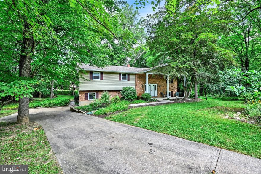 **Back on the market because the buyer's financing fell through.***Tucked away at the end of a quiet cul-de-sac in Sunny Acres, this spacious 6-bedroom 3 full bath home sits on one of the largest, most secluded lots in the neighborhood—surrounded by mature trees for ultimate privacy. 

Inside, you’ll find abundant natural light, multiple living areas, and a large master suite featuring a luxurious master bathroom and laundry hookup conveniently located in the oversized walk-in closet. The lower level offers a separate ground-level entrance, a cozy fireplace, and a kitchenette—ideal for multi-generational living or guest quarters. Multiple decks provide perfect spaces for entertaining, yoga, or simply enjoying the peaceful outdoors. 

The property also includes a storage shed, an insulated cabin with power, and an exterior room under the deck for extra storage or a potential office. Lovingly maintained for years by the current owners, this home offers the rare blend of space, privacy, and convenience—just minutes from shopping, highways, and schools.