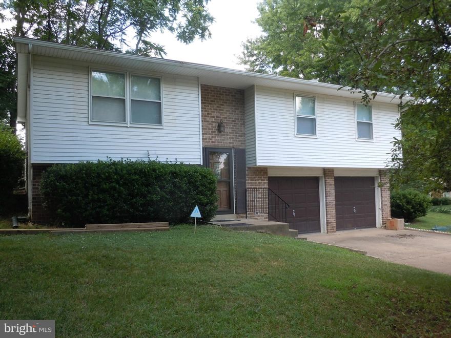 SOLD AS-IS! BASEMENT WITH TILE FLOORING, HALF BATH & STORAGE, DECK OFF BACK OF HOME, NEW SOFFITTS, HALF ACRE LOT, NO HOA!