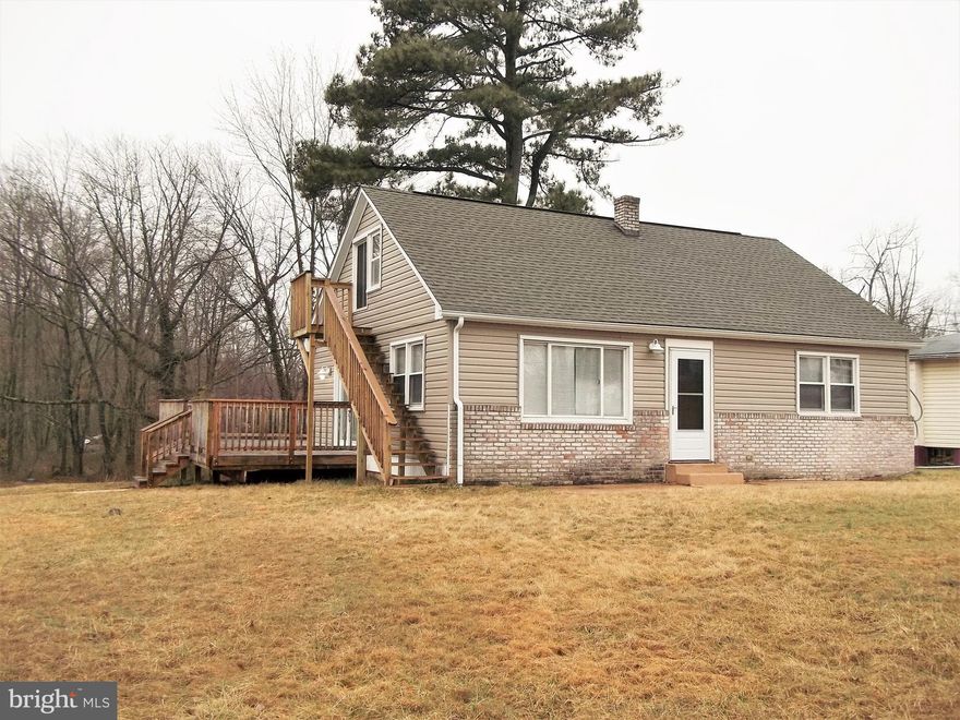 Shows like a NEW HOME! Fully renovated in 2016 - Kitchen, Baths, Windows, Roof, Walls, Floors, etc. Open floor plan, over a half acre, public water & sewer. 2nd floor loft with half bath, add a closet & it's a 3rd BR or an upstairs family room/ man cave! Kitchen has SS Appliances, plenty of  recessed lights, & ceramic flooring. Large Deck in rear with view of trees. Hurry to see this one!