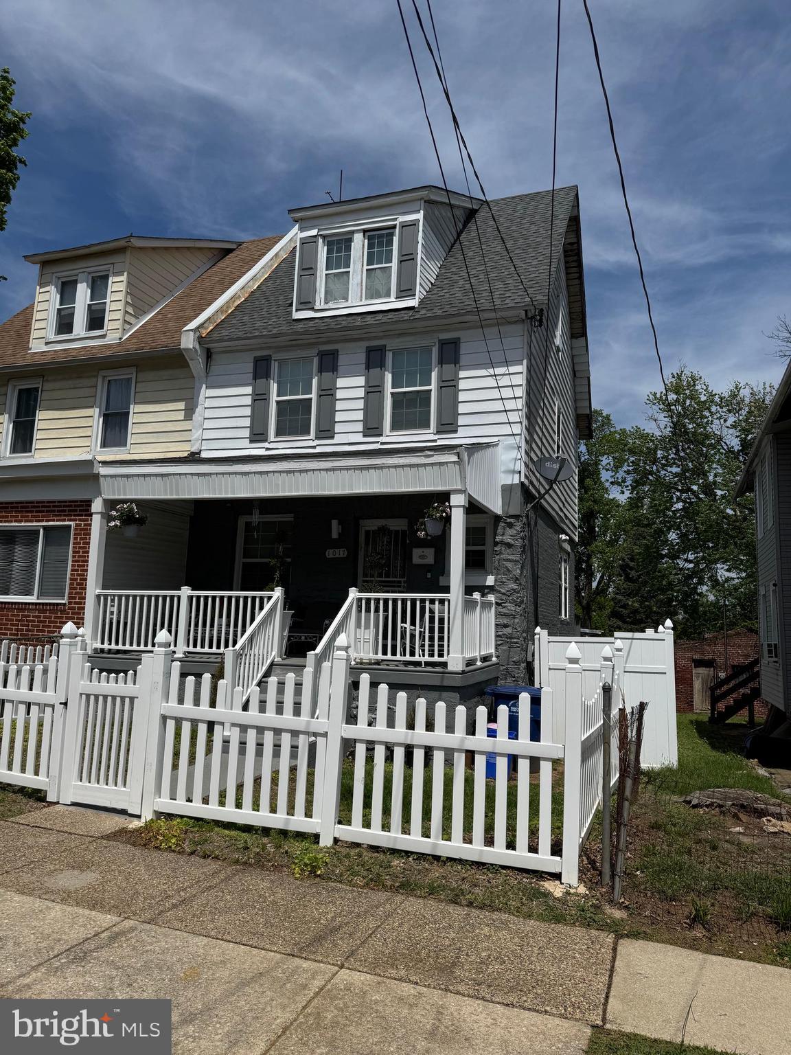 Large twin home for sale, Open porch area, Living room with powder room, Dining room, Straight through Kitchen with exit to large Deck. 2nd Floor offers 2 bedrooms with full bathroom, 3rd Floor is very large bedroom with full bathroom Full Basement. Large Yard. Must See
