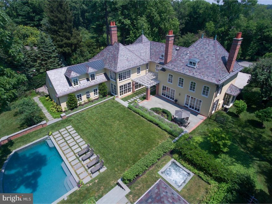 Majestically set on a gently rising, superior 1.5 acre lot on a coveted street in the Villanova Estate area, this classic French Country residence was originally designed by the renowned Architect Walter K. Durham. The architectural goal of recent expansions was to preserve and enhance the original dramatic "Durham" design elements, such as floor to ceiling windows and to produce a home that is perfect for family living and entertaining. An "open" plan, coming from the entrance courtyard is now synchronized, visually, through the home to the rear pool area walled courtyard, creating a melding of interior and exterior spaces. Similarly, a "chefs' dream" Gourmet Kitchen now opens up to a spacious Family Room with breathtaking views of the glorious grounds, pool, spa, terraces and Pool House. The new executive retreat now features approximately 9000 square feet of exquisite living space. Gracious room sizes with high ceilings, expansive bright windows and a wonderful open flow. The home features 5 en-suite bedrooms, 6 full and 2 half custom baths and a fully finished daylight Lower Level. The entire landscape was designed by an award winning Landscape Architect. A European gravel entrance circular auto court, rear walled courtyard, an Alee' of "tree form" white hydrangeas, magical English Oak Pyramid street trees, Blue Princess Holly detailing, extensive Belgian block borders and Pennsylvania Blue-stone capped walls. Vermont slate roof, copper down spouts and gutters, extensive exterior molding detail, one of a kind custom crystal and brass detailed railings, and much more. CLICK ON CAMERA ICON ABOVE TO VIEW DRONE VIDEO! Qualified inquiries only. Casual viewings discouraged.