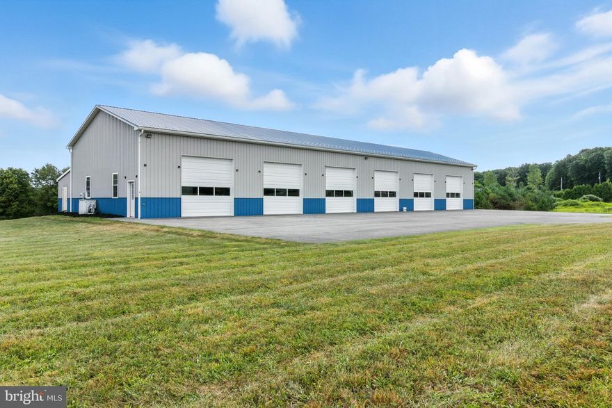 **Expansive Industrial-Grade Garage with Modern Features**
Presenting a massive garage ideal for automotive, storage, or workshop use. Spanning a robust 40x128 feet, this facility boasts a 16-foot ceiling, providing ample vertical space for any project or storage need.
**Garage Doors:** Equipped with six 12x12-foot doors, this garage ensures easy access and accommodation for larger vehicles and equipment.
- **Additional Access:** Three 36-inch man doors provide convenient entry points.
- **Utilities:** Outfitted with 220-volt electric service for all your power needs.
- **Climate Control:** Two hanging heaters, each at 250k BTU, ensure a warm workspace year-round.
Perfect for the classic car enthusiest  or any motor sport, this garage is a rare find. Don't miss the opportunity to make it yours.—  With over 5 acres,  just add your dream home to the lot.