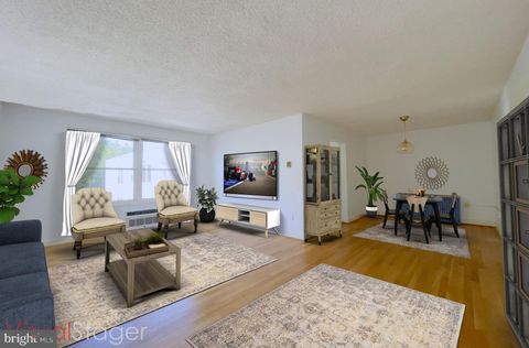 Photo of 7630 TOMLINSON AVE #32, CABIN JOHN, MD 20818 (MLS # MDMC2062114)