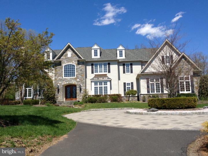 Elegance abounds in this beautiful custom home on almost an acre of land in sought after Woods at Gwynedd Valley neighborhood. All stucco removed and remediated - replaced with Hardie plank May 2014. Gleaming Travertine floor in foyer and wet bar counter in family room, Chellew cabinets in kitchen and butler's pantry. Expansive gourmet kitchen w/top-of-the-line stainless appliances, granite island as well as counters and backsplash. Luxurious master suite with three walk-in closets, a fireplace in the sitting room, a dressing room with marble topped vanity, sumptuous master bath with a Jacuzzi tub, oversized frameless shower, marble floors and vanity and a private patio overlooking the rear yard. Enjoy evenings on the flagstone patio that overlooks the heated in-ground pool featuring a spa and waterfall feature and a fenced rear yard. Additional assets include: a built-in Sono's speaker system in the Kitchen, the master bedroom and master bathroom and the outside, 10' ceilings on the first floor and 9' ceilings on the second floor. The walk-out basement has been plumbed for a bathroom and offers lots of storage
