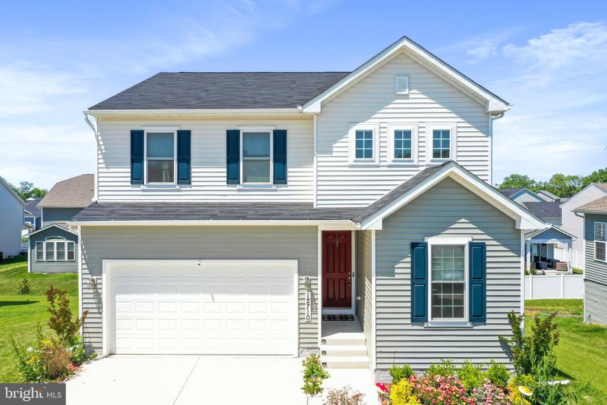 This multigenerational home is 2 years young and has tons of room in sought after Hagers Crossing! It boasts 4 Bedrooms & 3.5 Bathrooms. There is a large 2 car garage with a painted floor. There is an office on the main level as you walk into the home. The living room, kitchen and dining room are all open to one another with gleaming wood floors. The kitchen is absolutely gorgeous with backsplash and an island with seating. Off the kitchen is a composite deck where you can watch a beautiful sunset. 

Downstairs there is an entire in-law suite including room for storage and an additional 4th bedroom with walk in closet. There is a full bath with a tiled shower and a kitchenette too. The possibilities are endless - In-law suite, rent out the basement, get away space, etc. It is a walkout basement with access to the rear of the home. The upstairs has 3 bedrooms, 2 bathrooms, a rec room to hang out in and a laundry so you don't have to carry clothes all over the house. Built in wireless access point for stronger wifi so you can work from home too. You really need to see the inside of this home to appreciate the size and beauty.