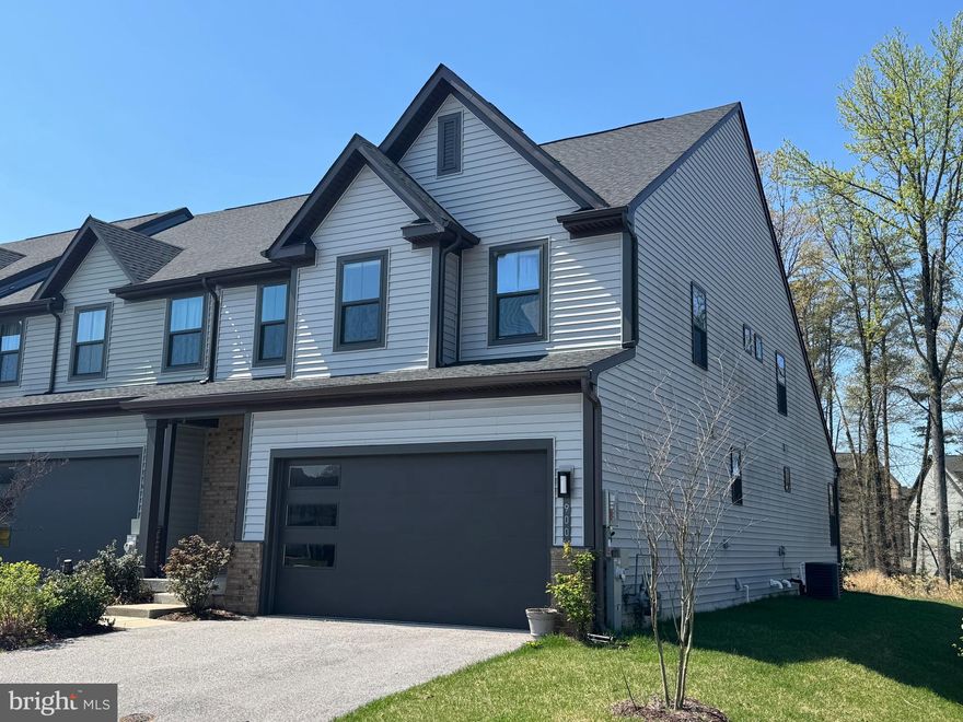 Terrific two-car garage villa in 55+ Tanyard Shores active community. Main level primary bedroom suite and laundry on main mean one level living. The upper level has two bedrooms and office space, plus a full bath. The lower level has a spacious efficiency apartment with kitchenette and full bath as well as a large storage/utility room. Enjoy outdoor living on your private deck that backs to a wooded area. Age in place with the Harbor House Community Center immediately next door to you. Enjoy the fitness center, yoga room, social club, outdoor community seating/grilling areas, outdoor fitness circuit, community garden, and much more.