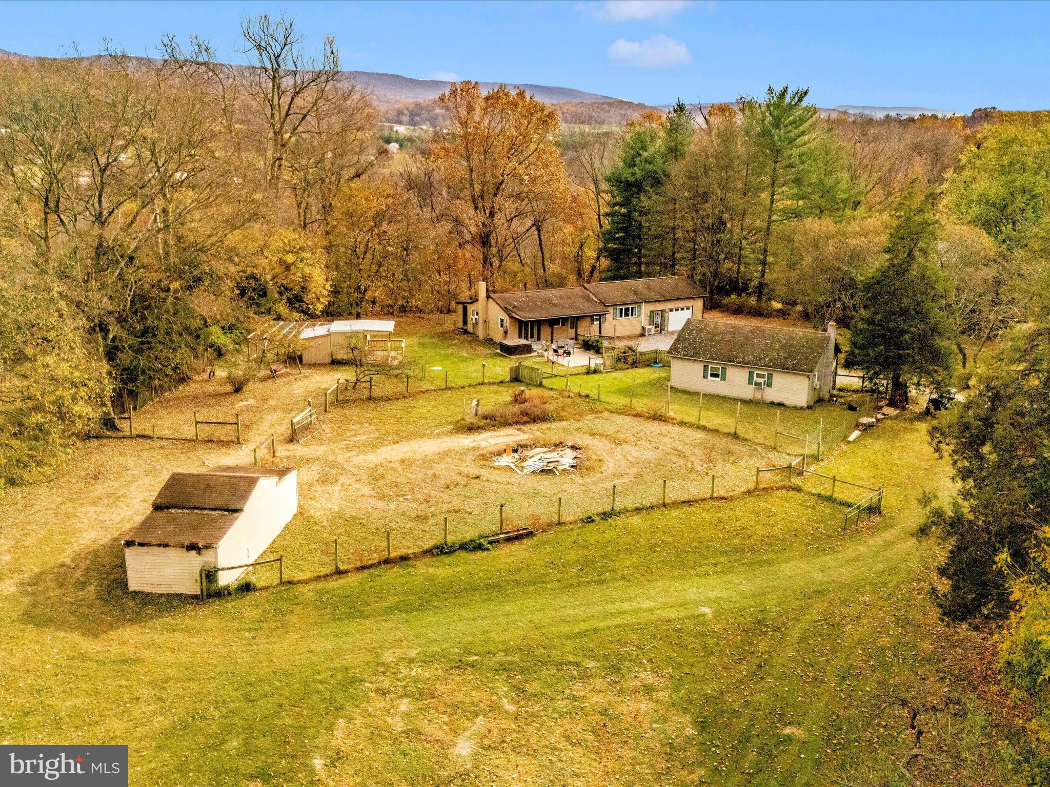 This charming home sits on 2.5 acres of fenced pasture, perfect for those seeking space and serenity. Enjoy modern updates throughout, including stylish sliding barn doors, a refreshed kitchen with wood countertops and an island, and beautifully updated bathrooms. The open floor plan offers plenty of natural light, while the oversized two-car detached garage and attached one-car garage provide ample storage. Currently installing a brand-new roof as well.