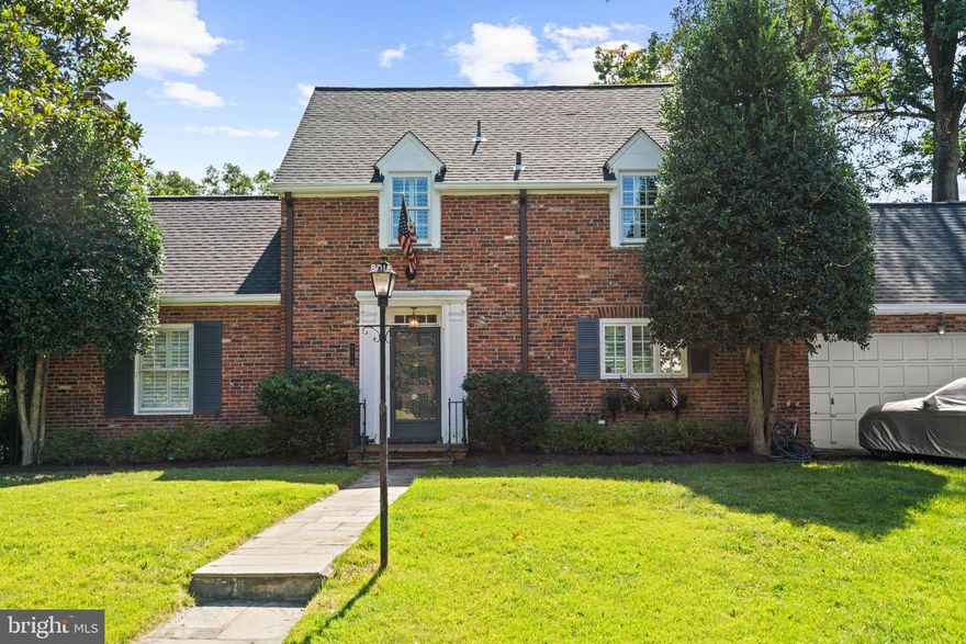 Welcome to The Hamlet, one of Chevy Chase’s most beloved and quietly elegant neighborhoods. Tucked between Rock Creek Park and Connecticut Avenue, The Hamlet feels worlds away from city noise, yet just moments from everything. Tree-lined streets, classic Colonials, and a strong sense of community define this pocket of Chevy Chase. Neighbors walk to nearby parks, local schools, and weekend coffee spots, while downtown Bethesda and Friendship Heights sit just minutes away. It’s that rare balance -- refined, yet relaxed.

This five-bedroom / four-full-bath Colonial offers the perfect blend of peaceful surroundings and urban accessibility. Offering 3,700 +/- square feet across three levels, it features quintessential details, including hardwood floors, built-ins, crown moldings, and two fireplaces.

Approached by a flagstone walkway and a level, manicured front lawn, the first floor features a seamless flow and multiple entertaining spaces: an inviting foyer; an elegant living room anchored by a fireplace and glass doors to a rear, covered patio; a pristine, state-of-the-art kitchen that connects to the sun-filled dining room; and a family room with access to a second, expansive back patio overlooking a vibrant backyard. A main-floor bedroom / den with wood-paneled walls, handsome built-ins, an en suite bath, and a walk-in closet -- along with an attached two-car garage -- creates easy living.

Upstairs, the owner’s suite is complete with a sizable walk-in closet / dressing area, an en suite bathroom, and a private patio with sweeping views. Two additional bedrooms, a hall bath, and a spacious second-floor attic for storage complete this level. The walk-up, finished third level features vaulted ceilings, an additional bedroom, and even more storage space.

The cheerful lower level features a recreation room with flexible bonus areas for endless opportunities, a bedroom, a full bath, a private entrance, laundry, and storage.

8019 Glendale Road is tucked away in a friendly, quiet Chevy Chase setting, yet it is centrally located with walking-distance access to public transportation, shopping, restaurants, and more, offering the best of both urban and suburban living.