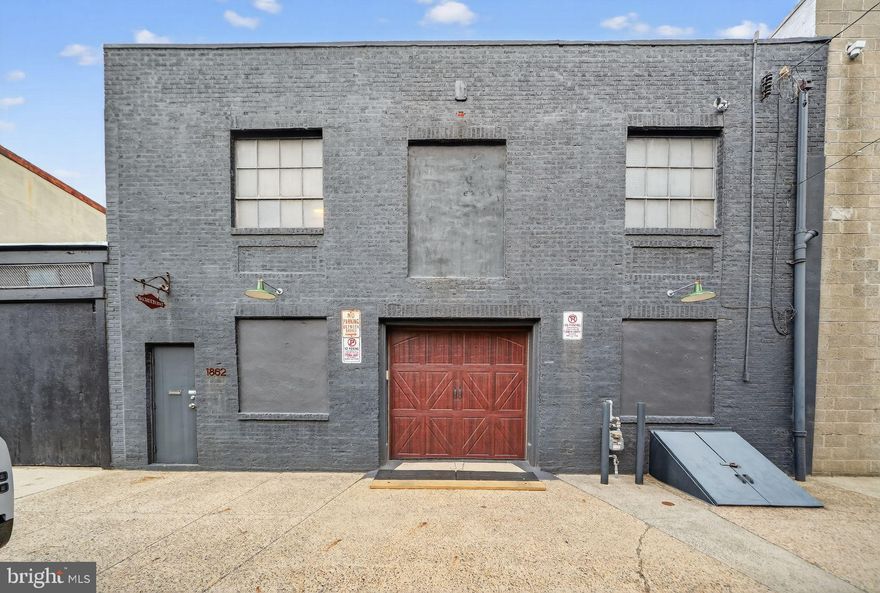 Prime Fishtown Live/Work Loft with 8-Car Garage 
Located in the heart of Fishtown, just half a block off Frankford Avenue and directly across from Riverwards Market, this unique mixed-use property offers an incredible opportunity for a live/work lifestyle in one of Philadelphia’s most vibrant neighborhoods.
The building features a flexible CMX-2 zoning designation (formerly C2), allowing for both residential and commercial use. The first floor is currently configured as a legal-use contractor’s shop/garage, offering approximately 1,500 square feet of clear-span space with high ceilings, plus a partial basement. With capacity for up to 8 vehicles, this is an ideal setup for contractors, creatives, or anyone in need of substantial workspace and storage.
The second floor offers a cool loft-style living space with a large open kitchen and living area, complete with granite countertops and new appliances. The spacious four-piece bathroom includes a jacuzzi tub and a large tiled shower. There is also a generous office space, perfect for working from home or creative use. Original hardwood floors run throughout, and above the suspended ceiling you’ll find additional height along with two original skylights, bringing in great natural light and character.
Step outside and you’re surrounded by some of Fishtown’s best, Kalaya, Suraya, LMNO, Loco Pez, Cake & Joe, and more, all just moments away.
This is a rare opportunity to own a versatile, character-filled property in a prime Fishtown location with true live/work potential.