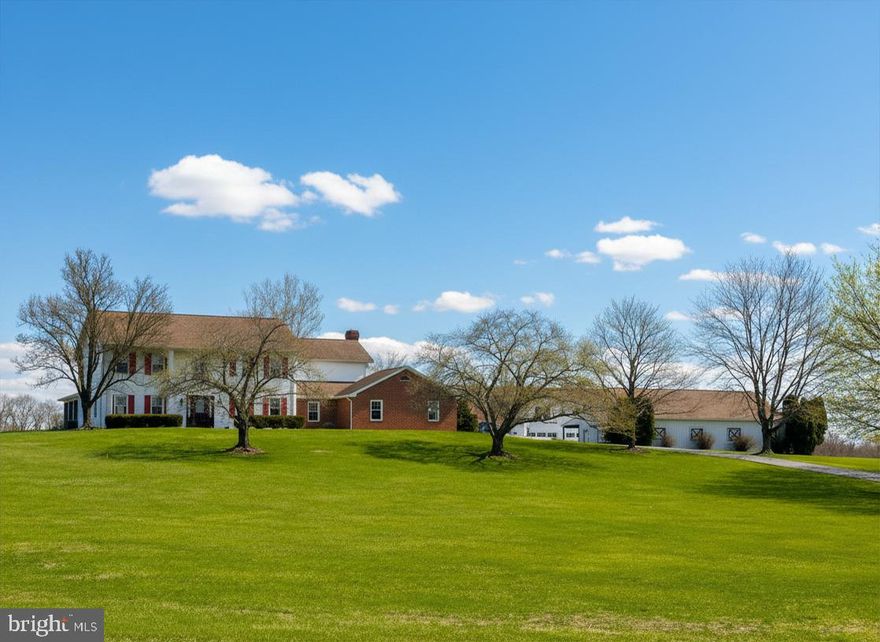 Set on 10.06 private acres in Fairview Township, 730 Seitz Dr presents a refined estate offering exceptional elegance, functionality, and versatility. With 3,062 square feet of living space, this 4-bedroom, 3 full bath residence is thoughtfully designed for both everyday living and entertaining.

A gracious interior unfolds with a living room featuring hardwood flooring, chair rail, and crown molding, while the inviting family room is anchored by a gas fireplace with custom built-in bookcases. The kitchen reflects timeless design and modern convenience, showcasing stainless steel appliances, quartz countertops, white cabinetry accented by copper hardware, tile backsplash, a breakfast bar, pantry, hardwood floors, and an adjoining dining area filled with natural light. A private office and main-level laundry enhance the home’s functionality.

The upper level hosts a spacious primary suite complete with a walk-in closet and en-suite bath. Three additional bedrooms, each with ceiling fans, and a full hall bath complete this level. The lower level extends the living space with approximately 500 square feet of finished game and exercise areas, featuring hardwood flooring and walk-out access via Bilco doors to the grounds. Outdoor living is equally impressive, with a covered front porch and enclosed rear porch overlooking the peaceful surroundings.
The home is further supported by an attached two-car garage, expansive attic storage, a newly installed well pump (2025), UV filtration system, new water filter, and recently cleaned vents.

A true highlight of this property is the incredible 7,000-square-foot detached garage, thoughtfully designed to support both everyday living and hobby pursuits. Built as a commercial-grade 40 x 60 concrete and steel girder bank barn, this impressive space features four oversized front garage doors and an additional rear entry, making it ideal for vehicles, equipment, or recreational use. The front section is fully equipped for working on vehicles with heat and electric, while the main level also offers full utilities for year-round use. Upstairs, you’ll find a spacious, climate-controlled office along with two loft storage areas—perfect for a home business or creative workspace. The lower level provides a large open area for additional storage or flexible use.

For families who love the outdoors or have a passion for animals, the property truly shines. A separate four-stall horse barn includes electric, a washroom area, and hay storage above—making it ideal for horses of your own or for children to grow up enjoying an equestrian lifestyle. This is a property where family, hobbies, and country living come together seamlessly. A joy to own.