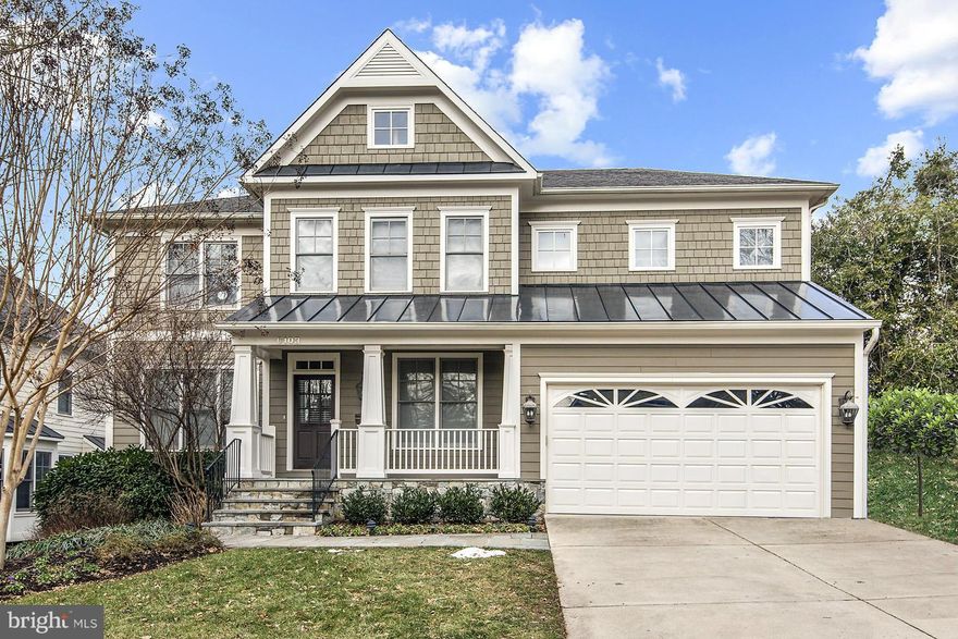 NEW PRICE, NEW LOOK, FRESH PAINT, OWNERS MOVED. Arts & Crafts style home with many special touches incl:custom iron railing & doors, renov powder rm, designer lighting, pretty hrdwds on 2 levels, cook's kitchen with granite, SS app open to FR w/ fp & den/office on main. 4 br/3fb on upper level w/ spacious master. LL w/ BR & FB has lge open rec room w/wet bar & fp that walks out to stone patio.