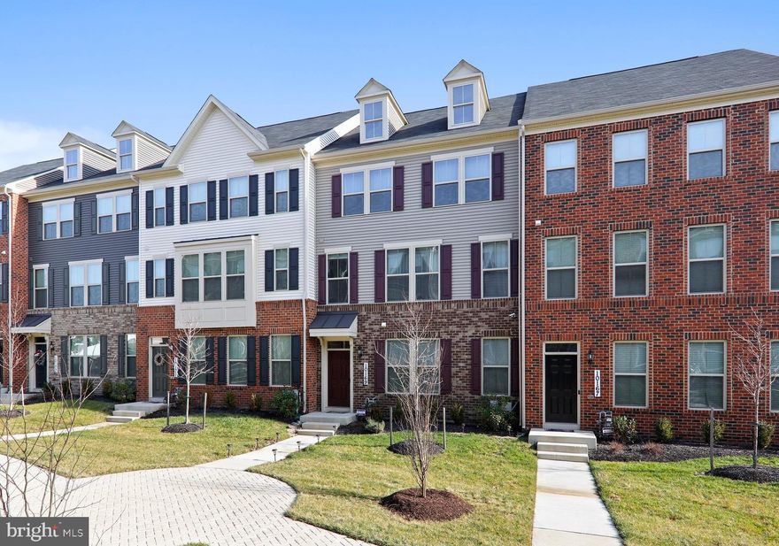 Move-in ready, spacious town home with hardwood floors, 9ft ceilings, recessed lighting, open concept floor plan,  expansive kitchen island, stainless appliances, granite countertops, large deck off the kitchen and rear loading, 2-car garage. Upper level has spacious master bedroom with en suite and huge walk-in closet, 2 additional bedrooms and convenient upper level laundry. Finished basement is above grade with large windows and plenty of natural light and full bath, could be converted to 4th bedroom.   Convenient location, minutes from NASA, Cash/Conventional/FHA/VA approved.