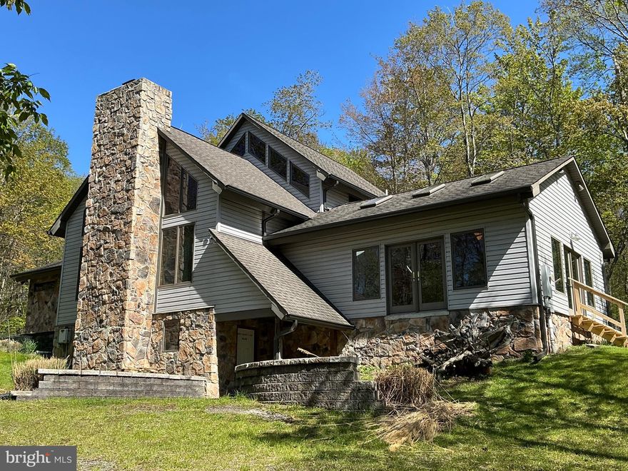 Welcome to mountain living at its finest.  Nestled on 6.89 private acres, 122 Woodlands Hill Lane offers the perfect blend of seclusion, space, and comfort in one of Garrett County’s most desirable settings. This impressive 4-bedroom, 4.5-bath home features approximately 4,000 square feet of living space designed for gathering, relaxing, and enjoying the beauty of Western Maryland.  The home sits on a 6.89-acre lot with surrounding  parcels also available.   Spacious living areas and multiple levels of comfort.

Inside, you'll find generous living spaces with warm finishes, hardwood flooring, and a fireplace that creates an inviting atmosphere year-round. The thoughtfully designed layout offers room for family and guests alike, while the expansive setting outside provides privacy and endless opportunities to enjoy nature. Features include a fireplace, wood stove, hardwood flooring, large basement, storage shed and  substantial interior space.  Other features include Anderson windows and doors, steam room/shower, infrastructure for central A/C and generator.  
Whether you're looking for a full-time residence, a mountain retreat, or a place to create unforgettable memories near Deep Creek Lake, this property delivers a rare combination of acreage, privacy, and convenience. Enjoy the peaceful surroundings while remaining just minutes from Deep Creek Lake recreation, dining, state parks, Wisp Resort, and all the outdoor adventures Garrett County has to offer.
Your mountain escape awaits.   Call today!
The following surrounding parcels are also available for sale, please inquire.    
Parcel 657 - 3.15 ACRES   
Parcel 634  - 5.0 ACRES  
Adjoining parcel 658 also for sale:  6.89 ACRES -  MLS #MDGA2011974  can also be purchased from separate owner