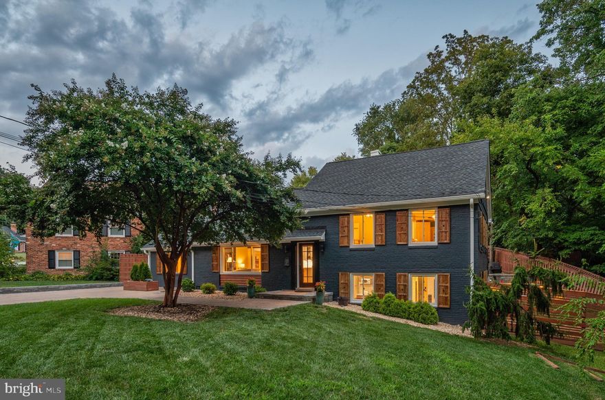 Gorgeously renovated in Braddock Heights! Located on a quiet, tree-lined street with creek views, this four bedroom  home will make you feel like you're miles away from the city. A true entertainer's dream - from the kitchen to the family room, the backyard patio to the fire-pit with a pizza oven! Featuring brand new appliances, modern tile, updated fixtures and so much more, this home is truly move-in ready with space for everyone. Enter into the foyer with herringbone patterned wood flooring and head into the living room with gas fireplace and open kitchen to your left. With an oversized island, 48 inch stainless range with double ovens, tons of crisp shaker-style cabinetry and a large sink - both the everyday cook and gourmet chef will be happy in this kitchen. The dining room is just off the kitchen and living room and can easily accommodate 10 or more for large gatherings. The rear of the home boasts a family room with fireplace and vaulted ceiling, a powder room and a large pantry. Gorgeous glass doors fully open to a massive, hardscaped patio and backyard oasis. A separate studio/office is perfect for working from home. The yard also features a tiered putting green, a fort, a fire-pit with a pizza oven and plenty of patio space for grilling and outdoor entertaining. Back inside, the second floor features a stunning primary suite with custom built-in closets, an en-suite bathroom and a private balcony overlooking the rear yard. A second bedroom and full bath round out this level. Up one more level you will find a large, airy bedroom with walk-in closet. Up one final level you will find a loft-like game/media room, storage and a half bathroom. The lower level of the home is great for game day or guests! Enjoy the recreation room with a mini-kitchen and space for a game or small dining table plus a fourth bedroom and full bathroom. Laundry and utilities are located on this level, and there is convenient access to the backyard from the bedroom area. Timber Branch is a quiet hideaway in the heart of Braddock Heights.  Enjoy walking, running or biking with peaceful stream views. Located close to the shops and restaurants of Del Ray and Old Town and conveniently located near I-395 and Reagan National Airport, you will love living here! Welcome Home!