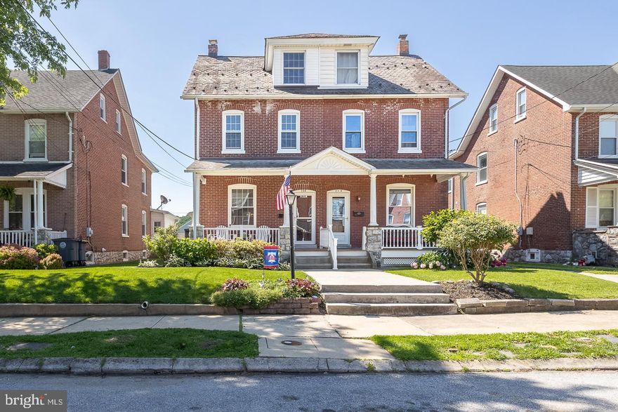 Welcome to 256 Highland Avenue – A Perfect Blend of Historic Charm and Modern Updates in Coveted Downingtown Borough! This beautifully maintained brick twin home offers the perfect mix of character and contemporary style, starting with its large, inviting front porch—the ideal spot to relax and enjoy the neighborhood vibe.  Step inside to find a spacious open-concept living area with hardwood flooring and intricate original woodwork around the windows, door frames, and dramatic staircase. The extended living room features built-in bookshelves, perfect for displaying your favorite reads or décor. The generously sized dining room flows seamlessly into a massive kitchen designed for both style and function. Enjoy granite countertops, white cabinetry, stainless steel appliances, a tile backsplash, brick accent wall, and skylights that flood the space with natural light. Recessed lighting adds a modern touch, making this a true heart of the home. Tucked just off the kitchen is a private laundry room with plenty of natural light and a convenient folding station. You'll also find a powder room featuring a modern blue vanity, shiplap accent wall, and fresh finishes.  Upstairs, the charm continues with a modern full bathroom that retains its vintage character—complete with classic tilework and a glass-knobbed door. Three spacious bedrooms are located on the second floor, each with neutral paint and plenty of natural light. Head up to the finished attic, a massive fourth bedroom that could easily serve as a home office, playroom, guest suite, or flex space—the choice is yours! The large unfinished basement provides ample storage and endless potential. The fenced-in backyard is completely hardscaped maintenance-free and designed for entertaining or relaxing with a decorative paver patio offering space for grilling, dining, or unwinding. Located in the heart of Downingtown Borough where neighborhood pride & festivities show on every holiday. This home offers walkability, charm, and easy access to shops, dining, and transportation. Don’t miss your opportunity to own this one-of-a-kind home where timeless charm meets everyday convenience!