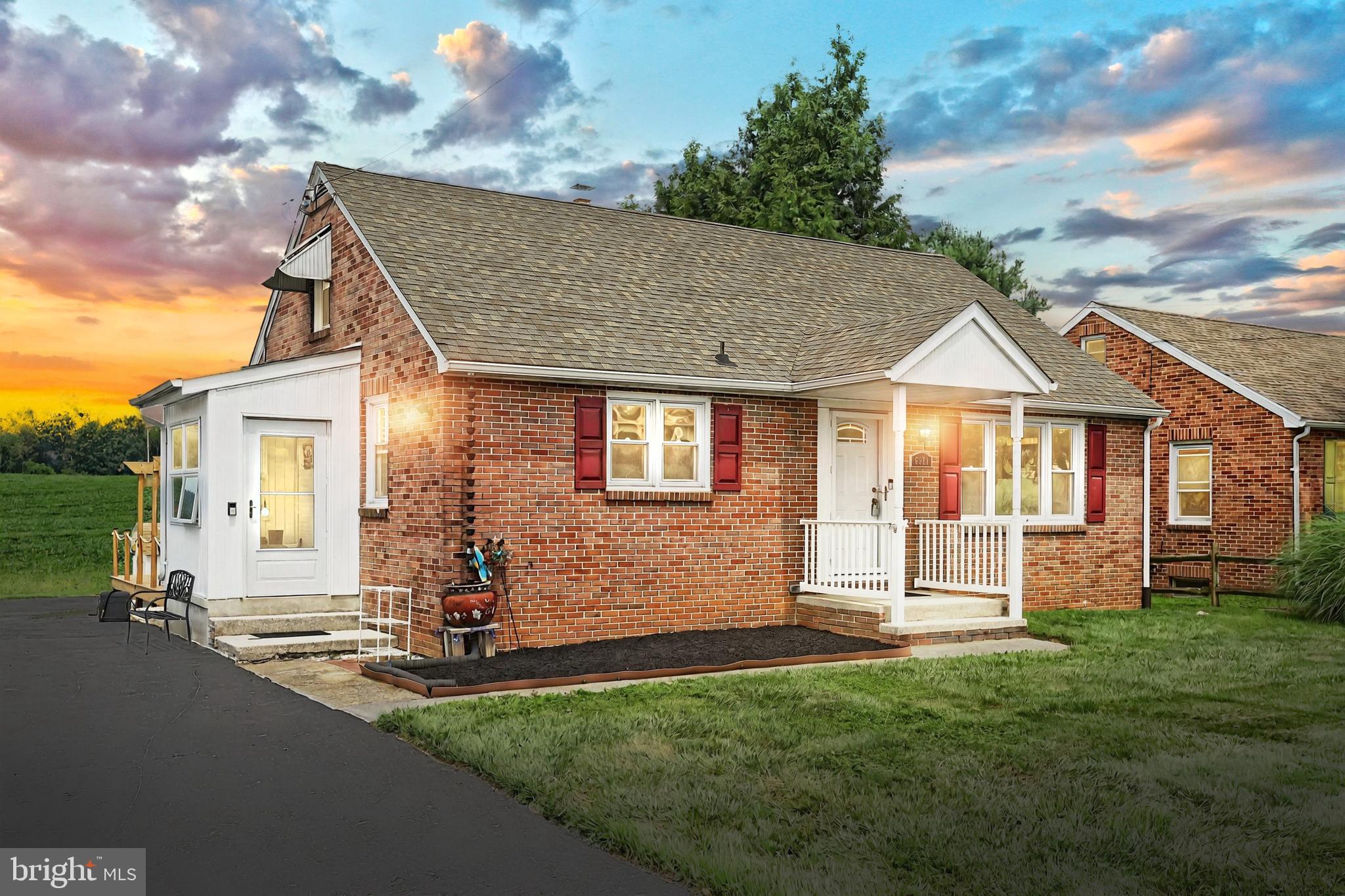 Don’t miss your chance to make this adorable home yours! This timeless brick cape cod was renovated in 2017 and has continued to be lovingly cared for and improved by the current owner. Conveniently located between Spring Grove and Hanover, this 4 bedroom, 1 bath home is situated on a .27 acre lot, backing to farmland, and screams pride of ownership! Key features include brick exterior, architectural shingle roof, vinyl replacement windows, wood floors, 200 amp electrical service and a generator hookup to run key components in the event of a power outage. A new furnace and central A/C system was installed within the last 2+ years, and the owner is including a Ring camera and motion sensor system in the sale.
On the main level of the home you will find a large eat-in kitchen with ample counter and cabinet space, living room filled with natural light, handy mud room, 2 generous bedrooms and a full bath with tub and shower. Upstairs are 2 bedrooms, each with handy built in drawers for storage. The full, unfinished basement with walk up to the backyard provides a laundry area, radon mitigation system and waterproofing system as well as ample storage space or potential for living space.
The exterior features of the property include a new 15 x 20 composite deck for your outdoor entertainment, lovely backyard with raised beds for your vegetable gardening, tons of parking in the driveway, an awesome detached one car garage, and even an adjacent shed for additional storage. This is truly a turn-key, low maintenance property!