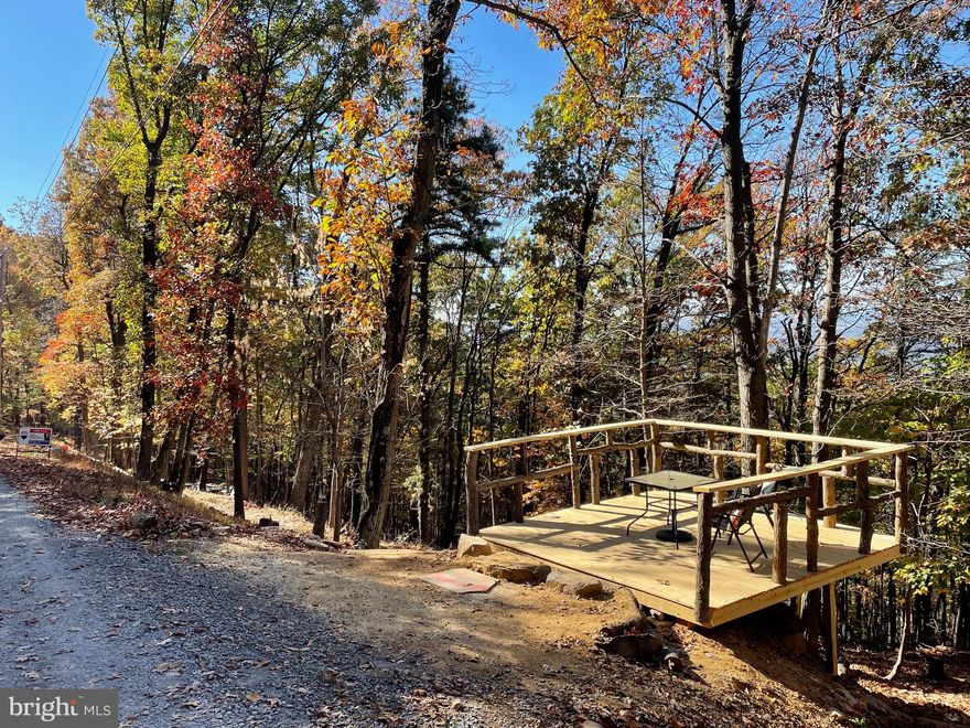 Discover a great opportunity to own an improved lot in Harpers Ferry that offers a 180 degree long range sunset view of the Shenandoah River, Charles Town, and Blue Ridge Mountains! It is the perfect location to get away from the hustle and bustle of a crazy work week. Located in a wonderful location for tranquility and peace while you enjoy the beauty of nature and wildlife around you. Hiking trails nearby also!  Seller built a brand new beautiful platform on the parcel to help enhance your camping experience!