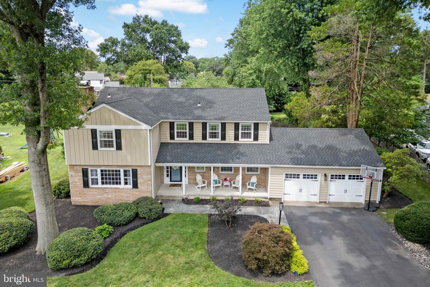 Set in the charming and very sought after neighborhood of Old Wynnewood in Yardley, this home is set amidst custom homes and beautiful trees in the desirable Pennsbury School District. This warm and inviting home offers the perfect blend of modern conveniences and classic charm.  With recently updated siding and a roof, there is so much this home has to offer!
Gorgeous landscaping and a beautiful covered porch entry welcome you to the home and open to a large slate floored foyer. The foyer is flanked by a versatile den ideal for a home office, playroom or quiet retreat.
The main level with hardwood floors throughout flows beautifully beginning with a spacious living room with a wood burning fireplace. A large formal dining room, with original corner cabinets sets the stage for memorable family gatherings. French doors lead to the well-appointed kitchen featuring Energy Star stainless steel appliances, stone countertops, counter seating for gathering, and a lovely eating area for family meals with a built-in bench for storage. A large sun-filled family room features a gas burning fireplace and walls of windows. A separate laundry room and powder room complete the first floor.
Downstairs a professionally finished basement provides a large game room, custom-built bar, Pergo travertine floor, a space for a full gym and plenty of storage. 
Upstairs a grand hallway connects four generously sized bedrooms including a serene primary suite with a remodeled spa-like bathroom with heated floors and a custom walk-in closet with built-in drawers and shelving. The hallway offers access to the large attic storage area. 
Step outside to your totally private and lush backyard oasis, complete with a resort style in-ground salt water pool and hot tub, expansive brand new trex deck, and brick patio. A fenced yard ensures security and pool safety. The backyard also includes a large shed for additional storage. The attached two car garage with inside entry includes additional attic storage.
Perfectly located near shopping, Route 1, PA turnpike, I-95 and I-295 as well as convenient rail stations for easy commute to New York, Princeton and Philadelphia. 21 Milton Drive is more than a house, it's an opportunity to live in the home of your dreams! Welcome Home!